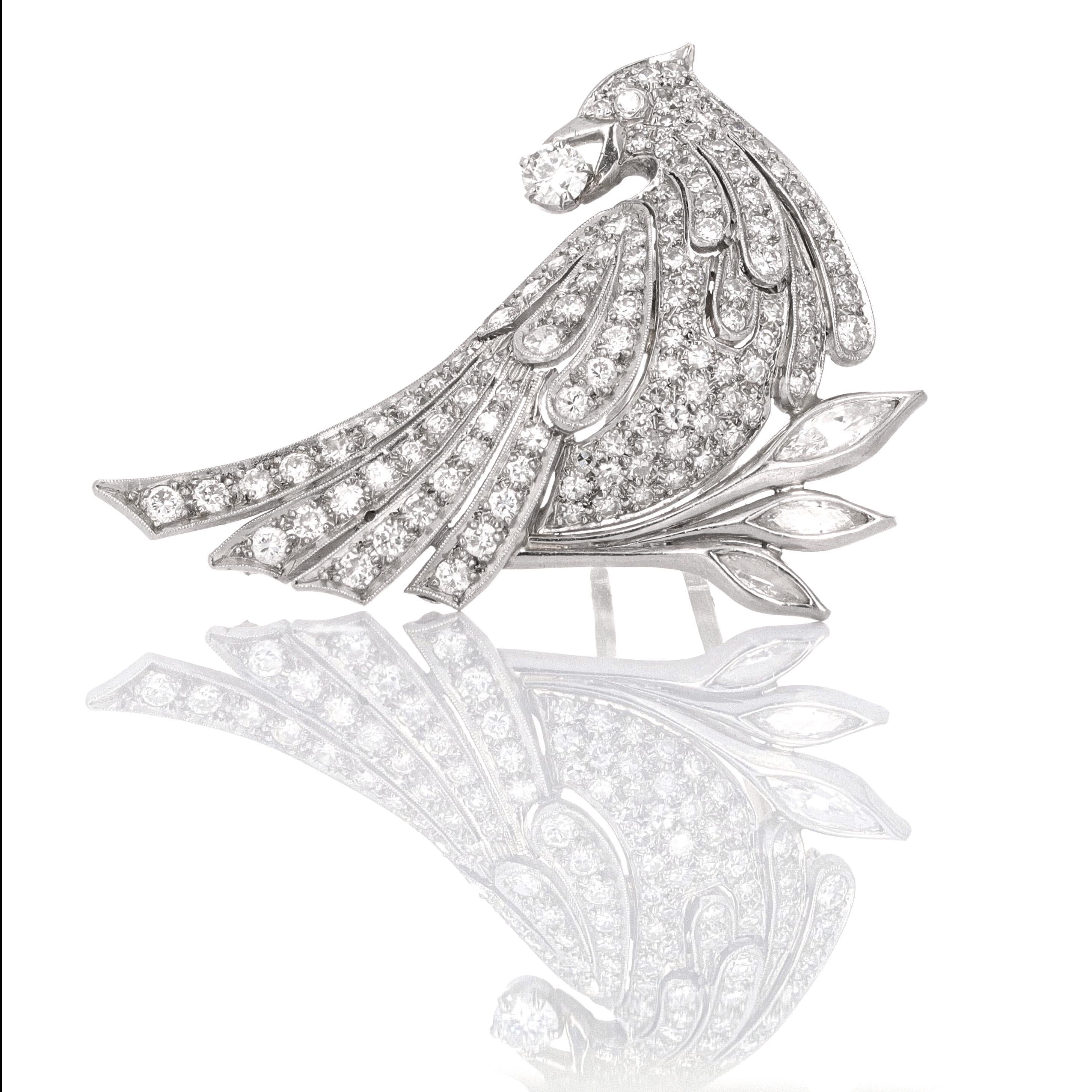 An impressive pair of platinum diamond bird brooches/ lapel pins. They are in mint condition and more beautiful in person than the picture. The pins have an estimated 6.00 carats of white, eye clean diamods.
