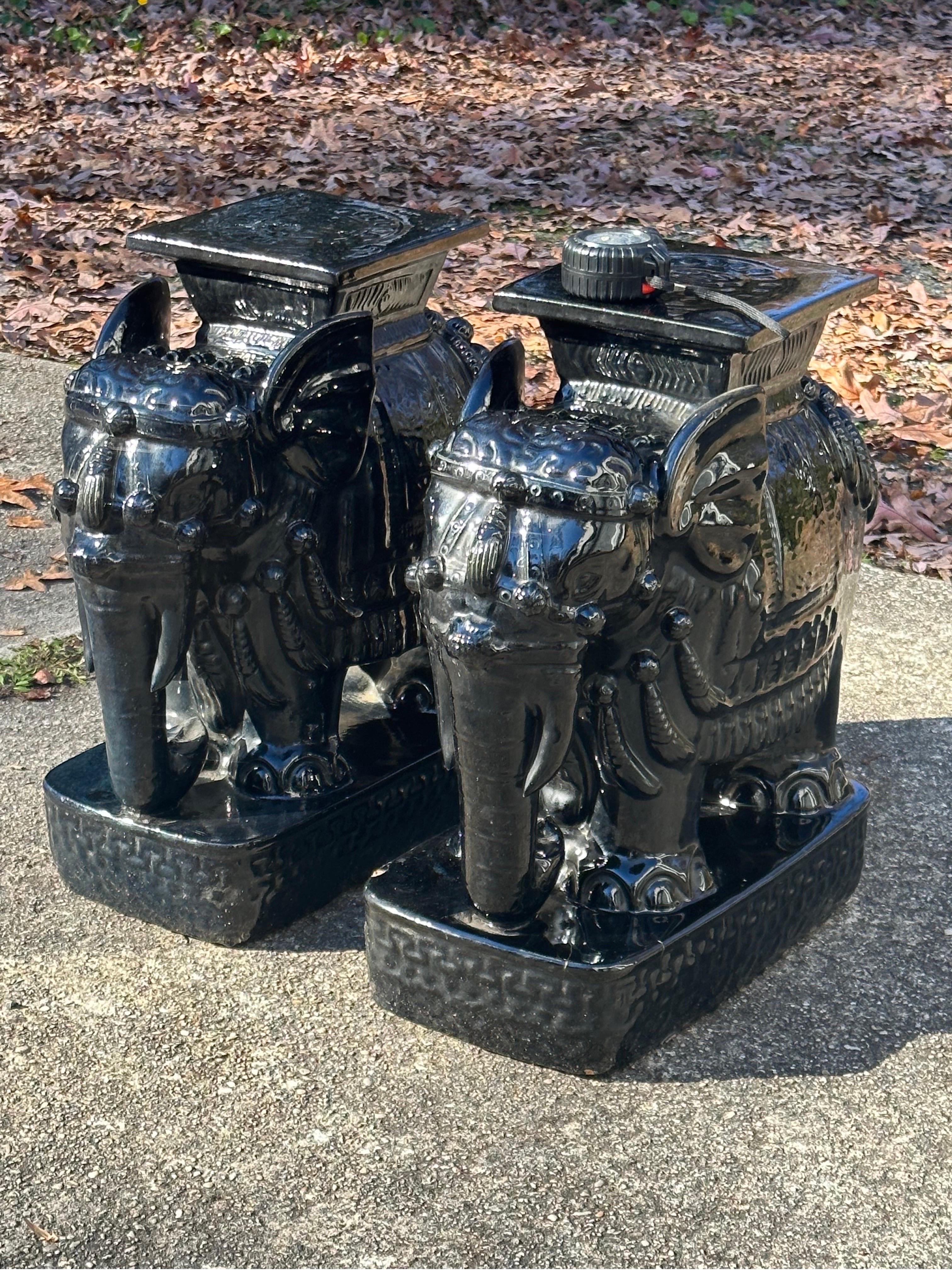 From a local estate, older pair likely 1940s or 1950s. Glossy black glaze and identical. One shows a chip to plinth base and a hairline crack. Both are very heavy and stable. 