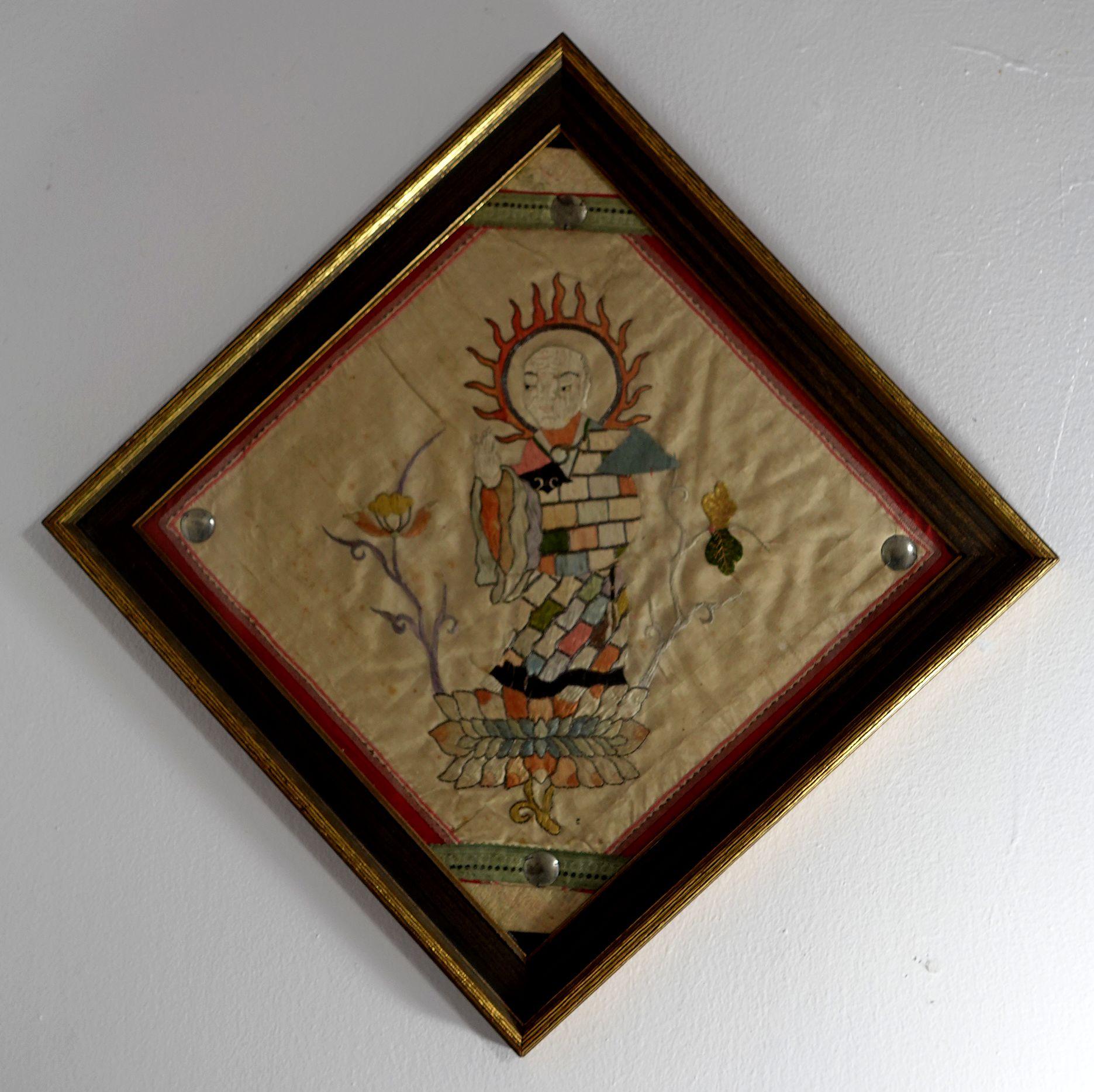 Antique Pair of Embroidered Panels of two Buddhist Saints (Lohans) sitting on the lotus. They are framed and with glass.