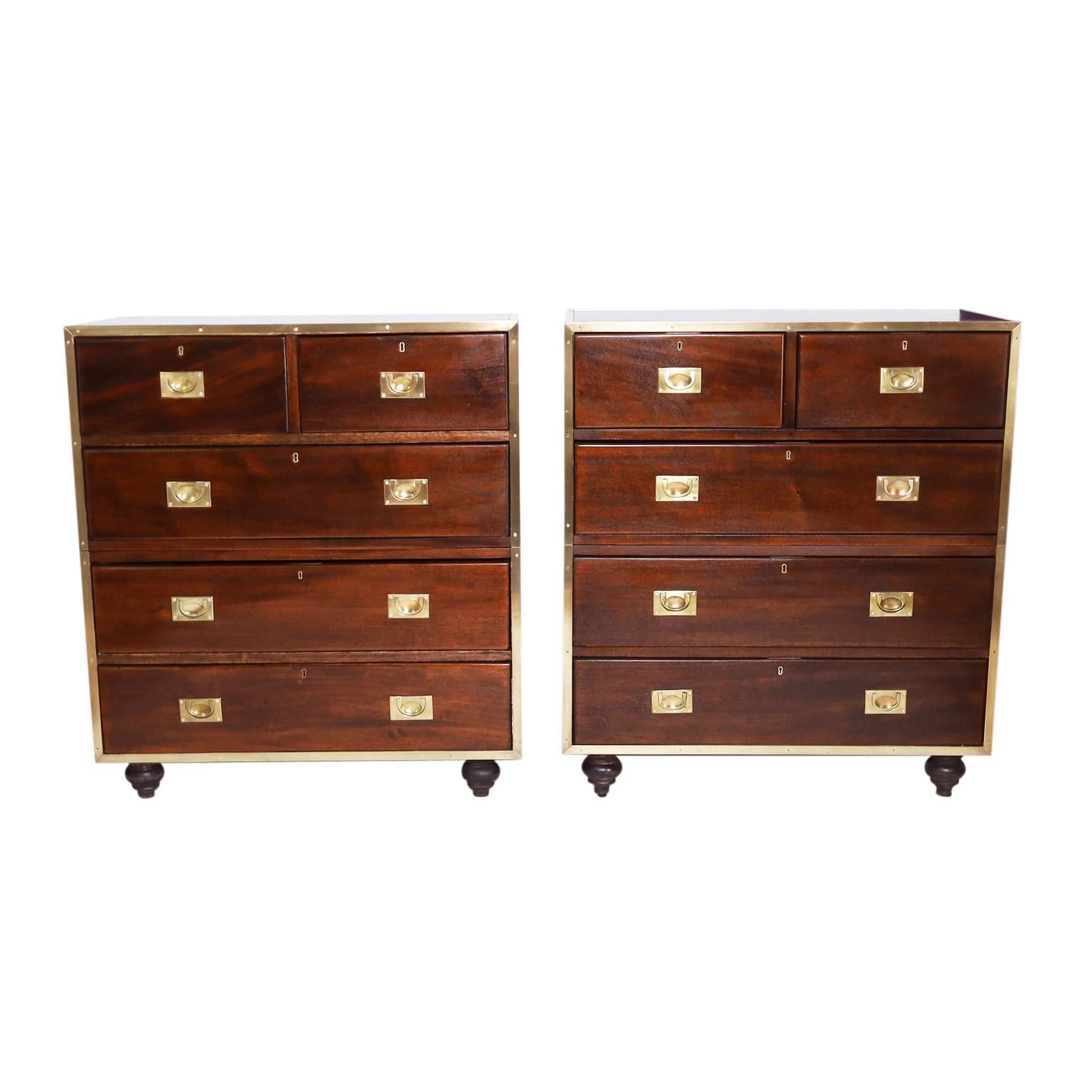 Impressive pair of English antique five drawer campaign chests crafted in mahogany in a two piece construction with brass hardware and turned feet. Signed Shapland & Petter one of Englands oldest furniture makers.