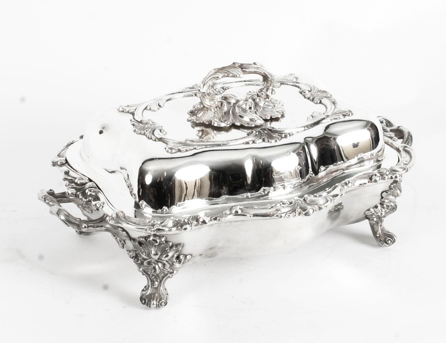This is an exquisitely high-quality and rare antique pair of English Old Sheffield silver plated on copper entree dishes, each with lid and Stand, circa 1820 in date, and bearing the early Old Sheffield makers mark of James Dixon & Sons.

These