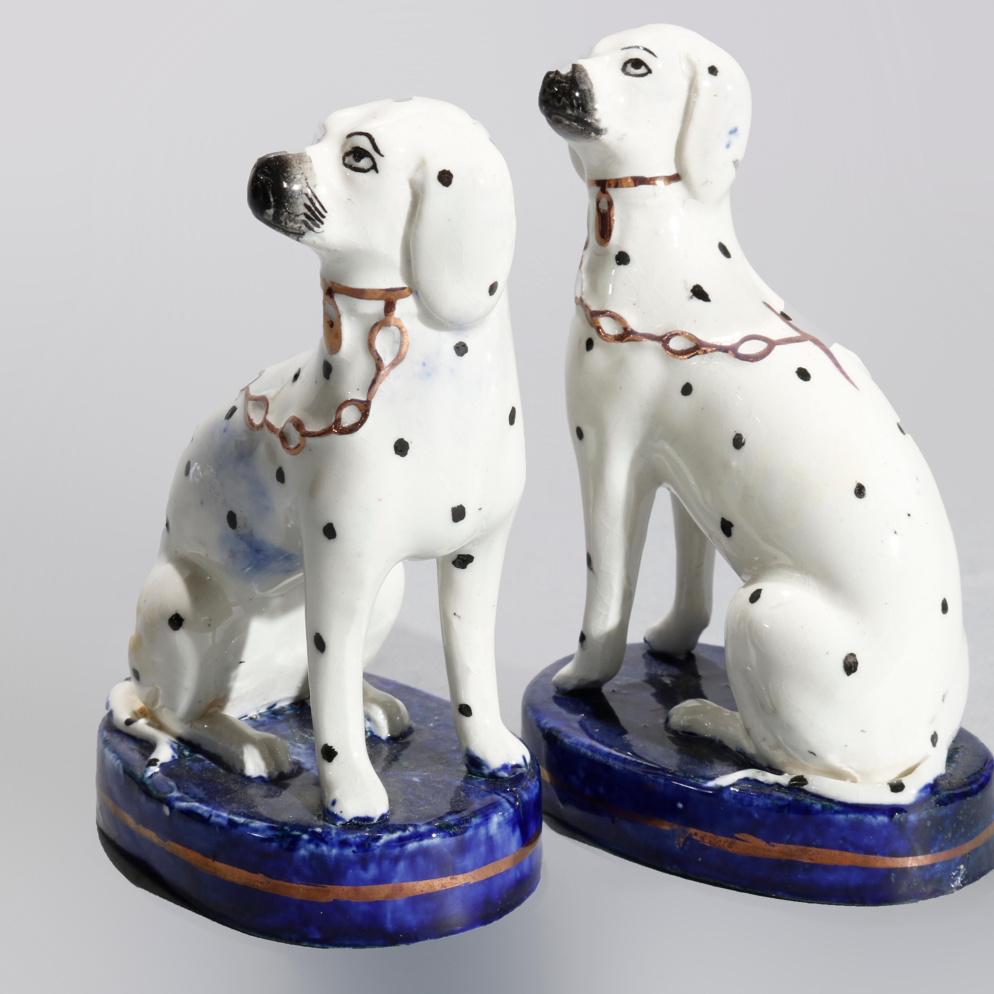 An antique figural pair of English Staffordshire porcelain Dalmation dogs seated on marble painted bases as photographed, 20th century.

Measures- 4.25