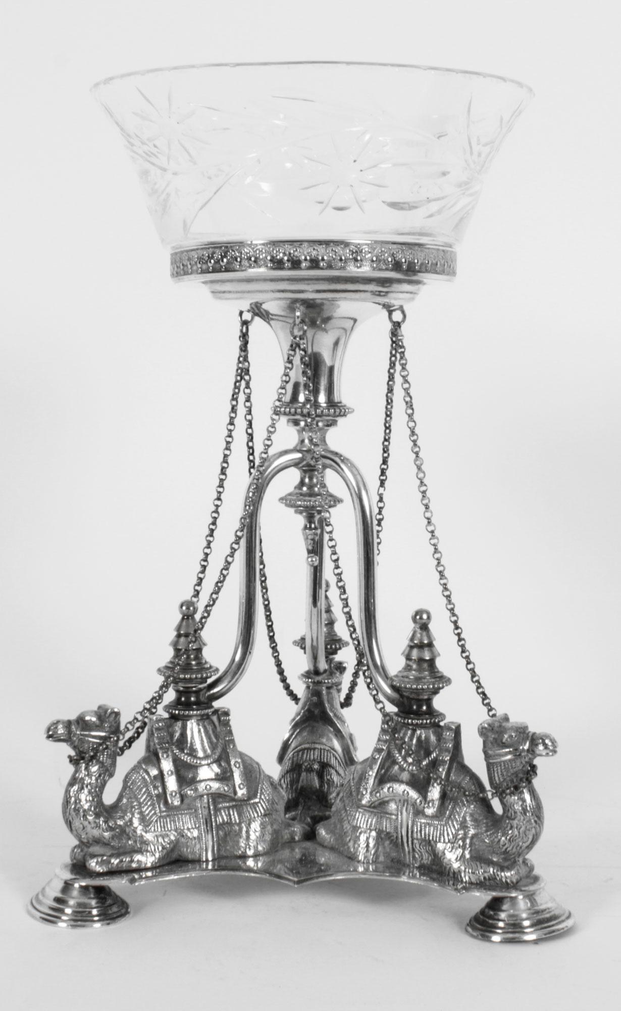 This is a stunning pair of antique English silver plate compotes each bearing the Victorian Registration Mark, circa 1870 in date.
 
The pair features three beautifully chased camels kneeling on the tripartite base on a central stems with