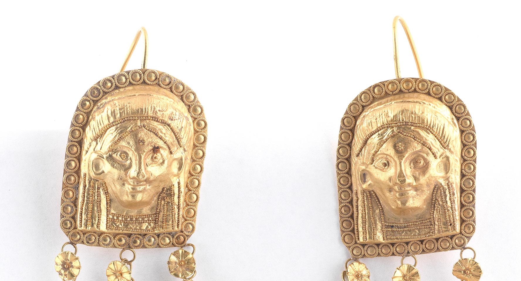 Mythological figures to the applied bead and ropetwist decoration, mounted in gold
length 8.5cm