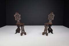 Antique Pair of Figural Heavily Carved Oak Sgabello Chairs Italy