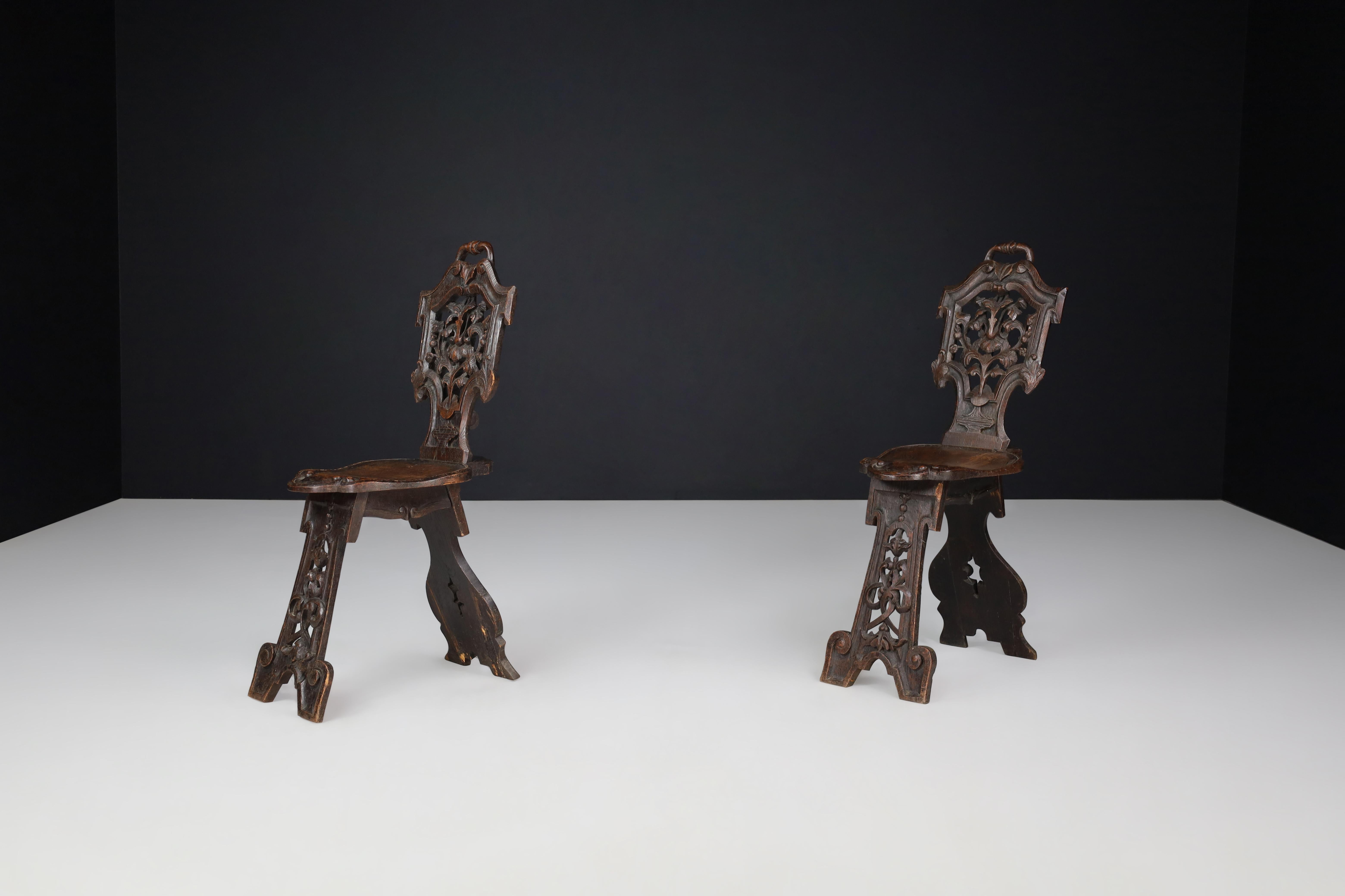 Antique Pair of Figural Heavily Carved Oak Sgabello Chairs Italy For Sale 1