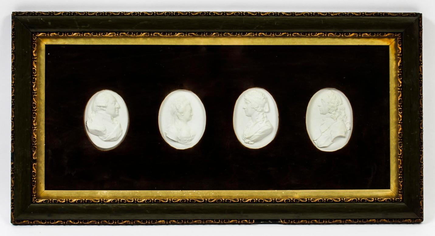 A pair of frames each enclosing four oval plaster Grand Tour intaglios, after James Tassie (1735-1799) and dating from the early 19th Century.
 
The intaglios are beautifully mounted on a plush felt ground in a pair of rectangular glazed box