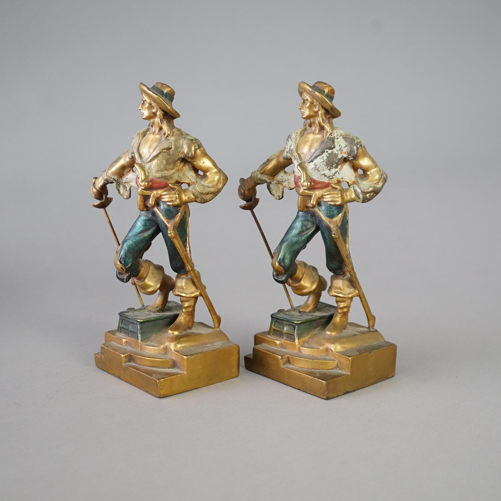 An antique pair of figural bookends in the manner of Frankart offer polychromed cast bronze pirate figure with sword, c1920

Measure - 10.5