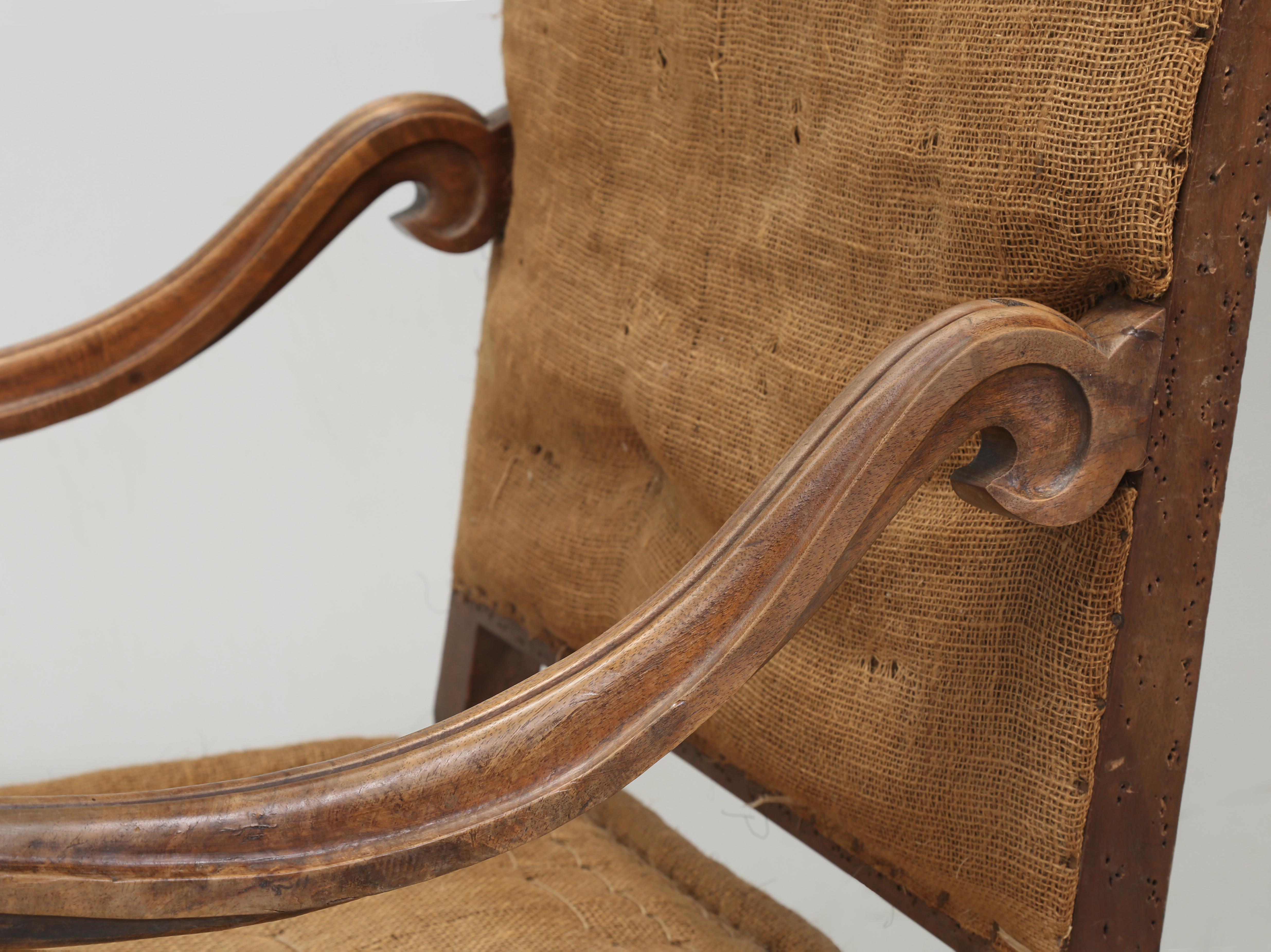 Antique Pair of French Armchairs or sometimes referred to as Throne Chairs in a completely unrestored condition. Whenever we receive a shipment of Antique French Armchairs from France, they virtually always have to be rebuilt from the frame up and