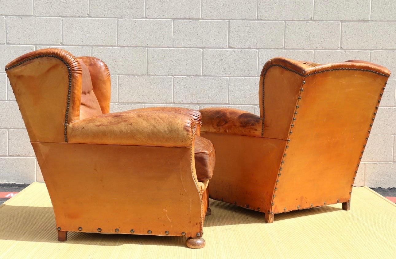 Antique Pair of French Art Deco Distressed Brown Leather Wingback Lounge Chairs In Good Condition For Sale In North Hollywood, CA