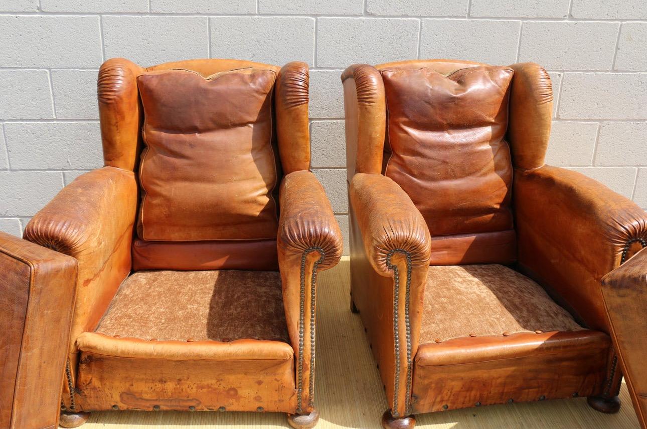 Antique Pair of French Art Deco Distressed Brown Leather Wingback Lounge Chairs For Sale 1