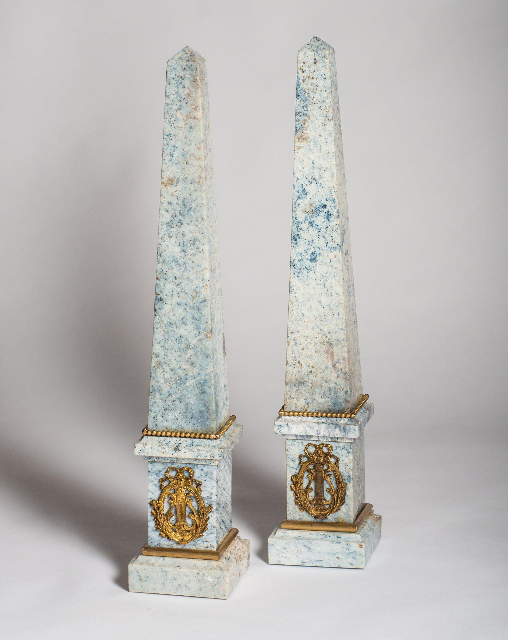 A pair of magnificent antique French Empire pale blue Jasper obelisks with original ormolu detail. Their grand size and proportion makes them highly desirable collectibles.