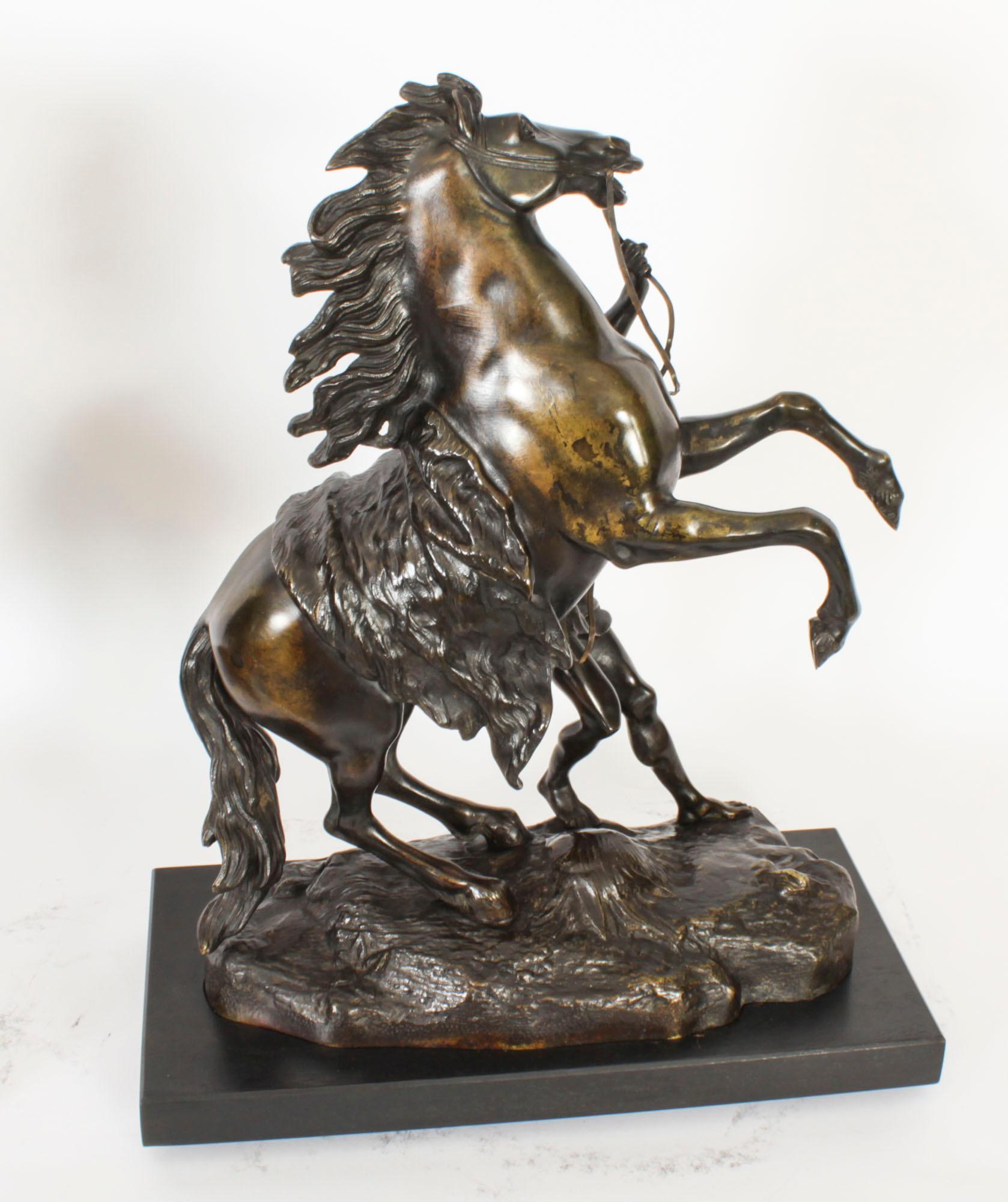 This is a fine antique pair of French Grand Tour patinated-bronze sculptures of the Marly Horses, Circa 1850 in date and signed to one base.
 
The original Marly Horses were commissioned by Louis XV of France, sculpted in Carrara marble, showing two