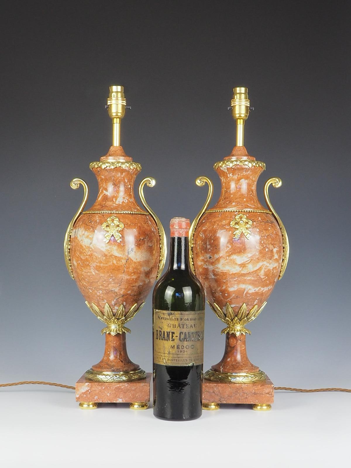 Exquisite pair of French Cassolette Rouge Marble Table Lamps exudes elegance and sophistication.

The intricate carvings on the rouge marble showcase the craftsmanship and attention to detail that was prevalent during the 19th century in