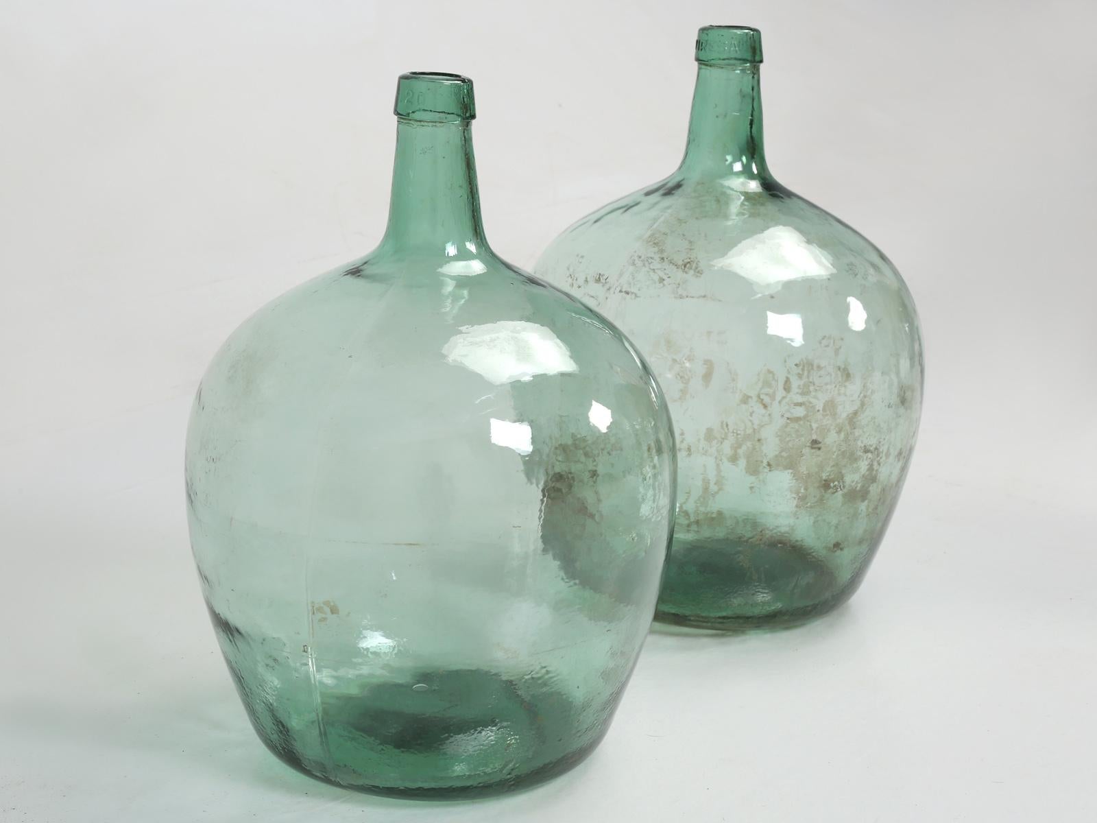 Great pair of antique French demijohn's, that could be made into a great pair of lamps? Carboy or demijohn or jimmyjohn, all refer to the same glass container, which will have a large body and a narrow neck. Demijohn's are believed to have