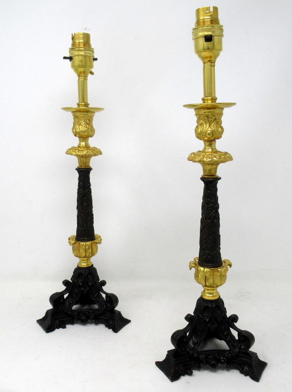 Stunning pair French heavy Gauge ormolu and bronze single light candlesticks of good size proportions, now converted to electric table Lamps, of nice tall proportions, each with tapering decorative central bronze columns, ending with three very
