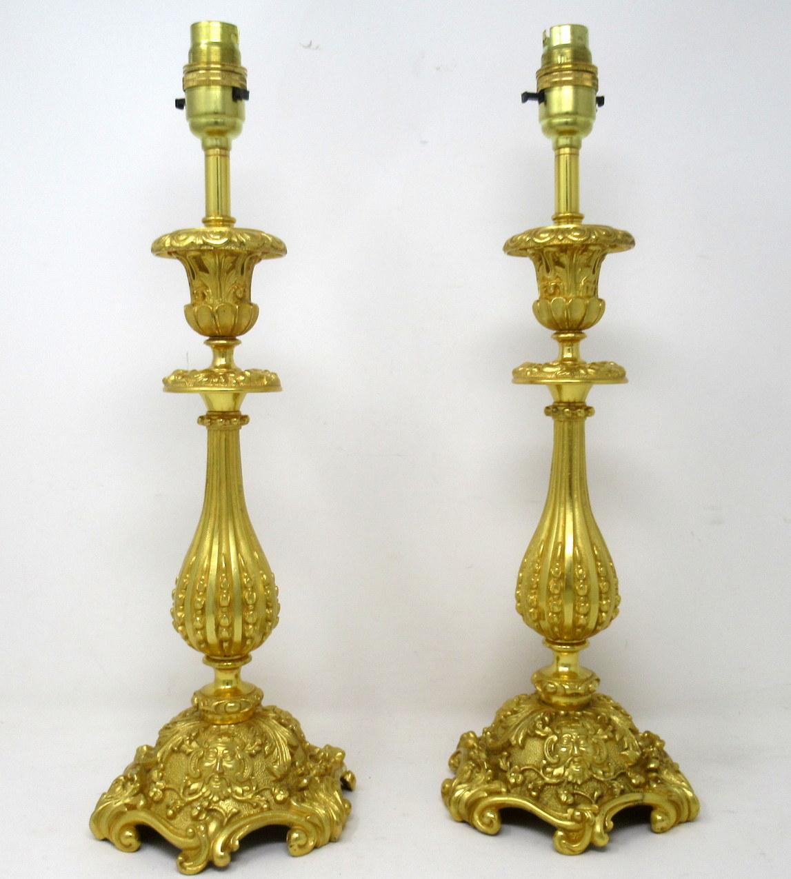 An Exceptionally fine pair french ormolu early Victorian single light candlesticks of generous proportions and outstanding chisel cast quality, now converted to a stunning pair of electric table lamps, offered in exceptional condition, each with