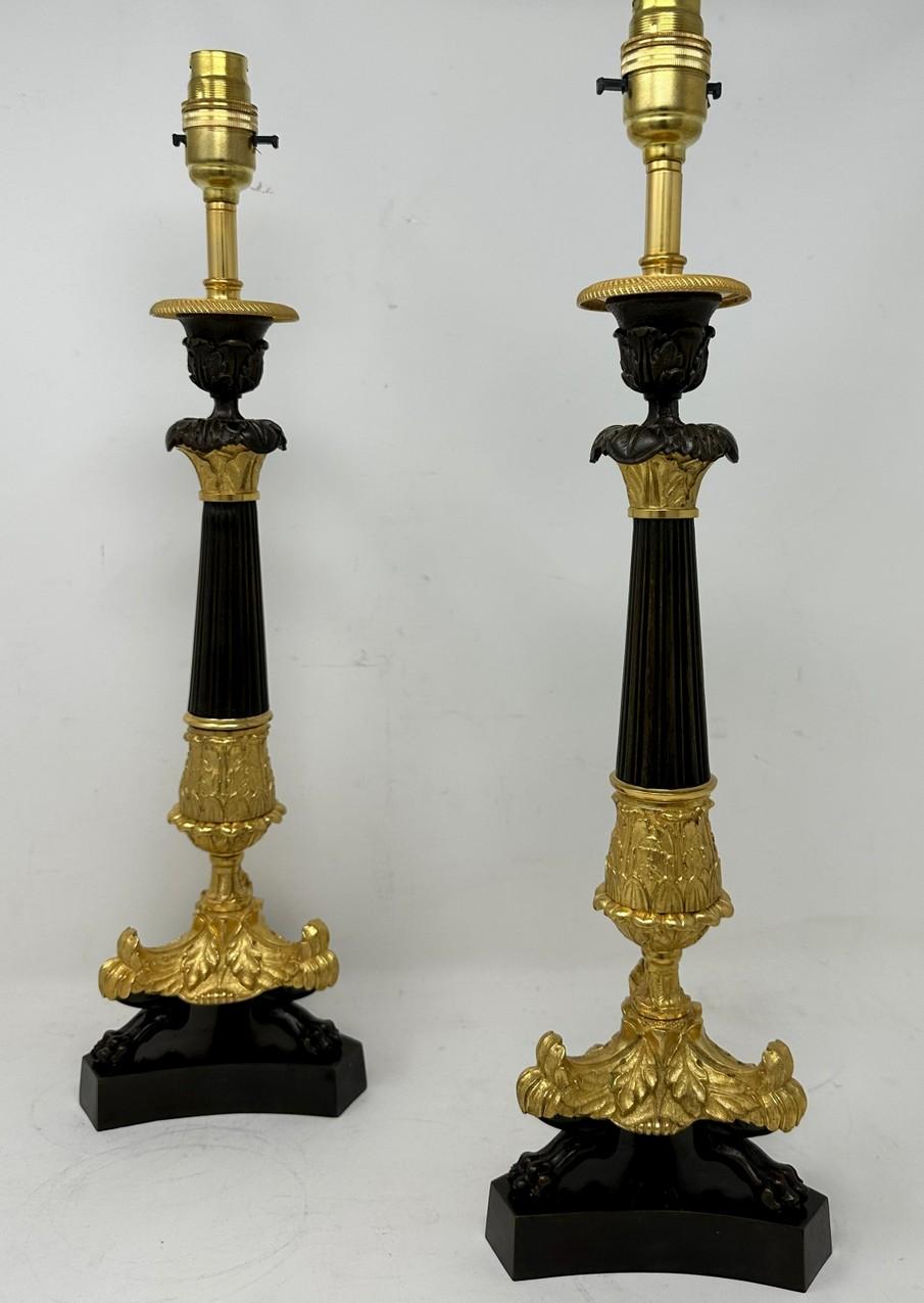 An Exceptionally Fine Pair French Ormolu and patinated Bronze Early Victorian Single Light Candlesticks of medium to large proportions, now converted to a Stunning Pair of Electric Table Lamps, offered in exceptional condition, each with unusual