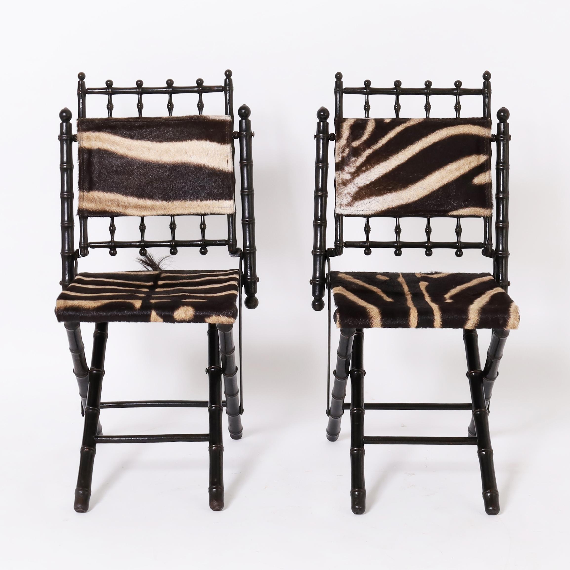 Impressive pair of late 19th century ebonized faux bamboo French aesthetics movement side chairs with burchell zebra hide, each with ball and spindle crests above a padded back and sling seat on an X form base.