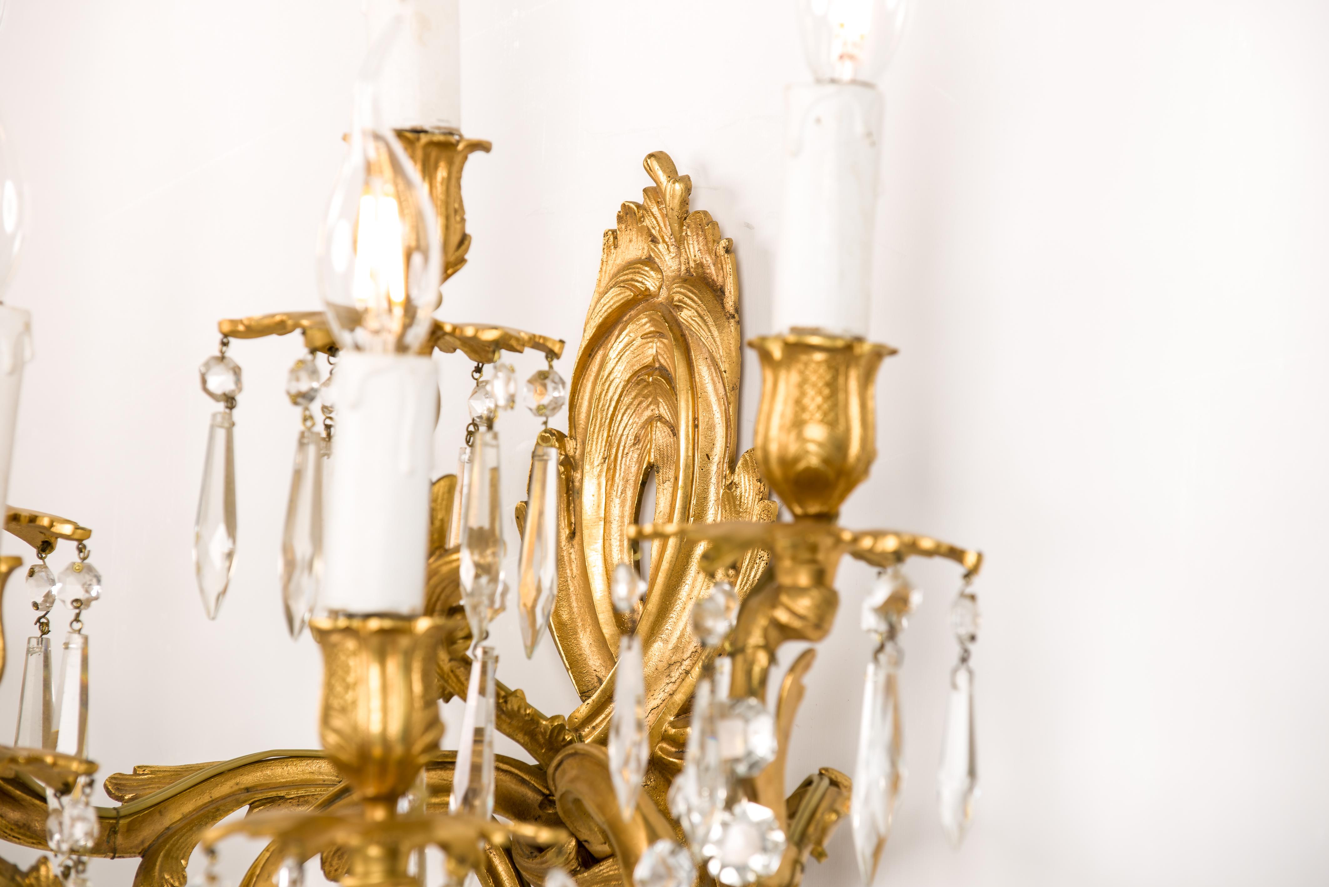 Bronze Antique pair of French fire gilt bronze and cut crystal  Louis XV sconces For Sale