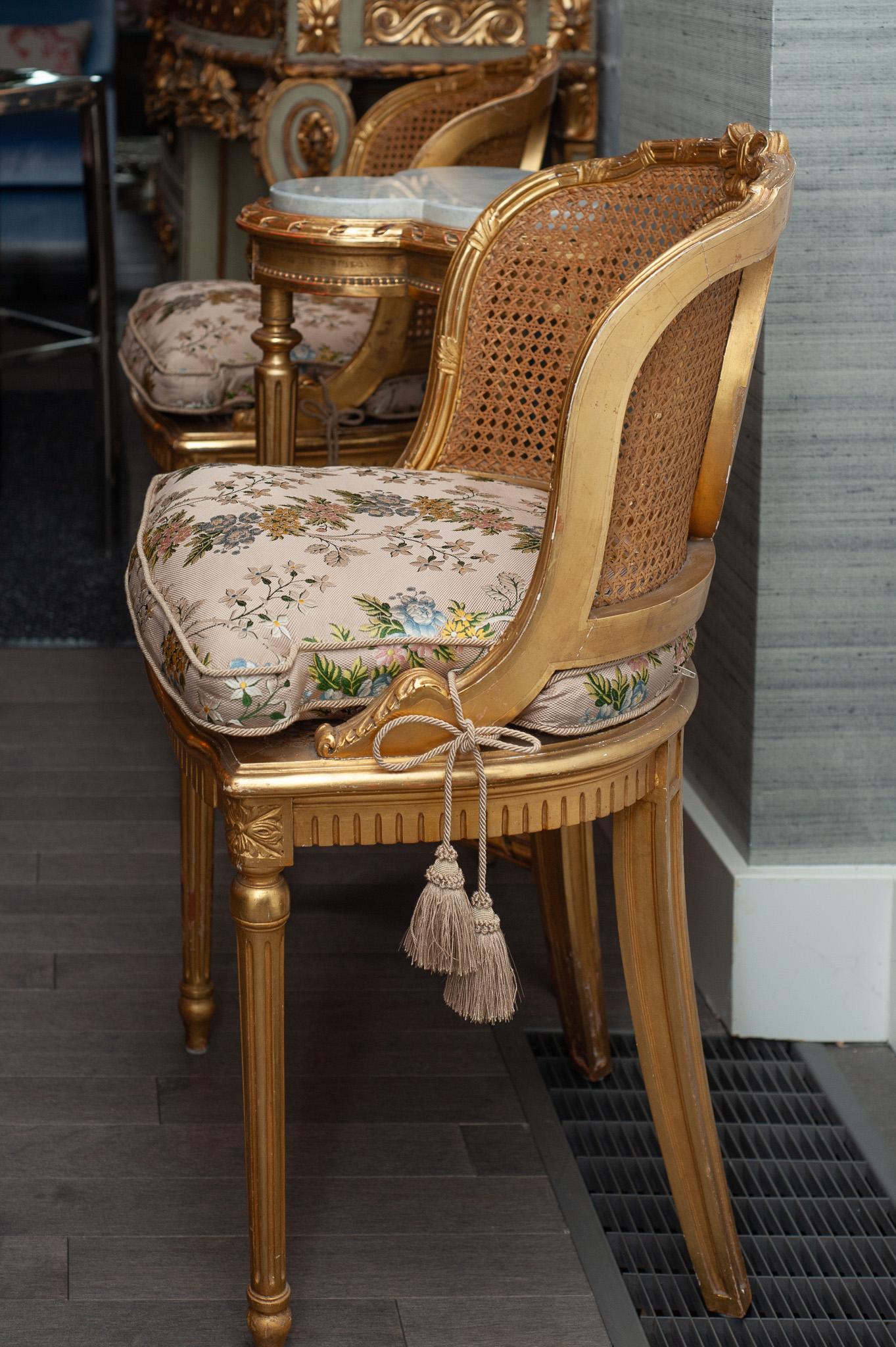 Gilt Antique Pair of French Gilded Chairs with Cane Webbing and Upholstered Cushions For Sale