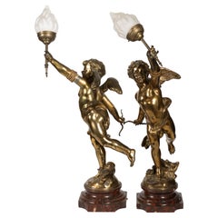 Paire de lampes Cupidon françaises dorées d'après Eutrope Bouret (1833-1906)