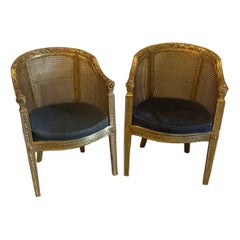 Coppia di poltrone bergère francesi d'epoca in legno dorato