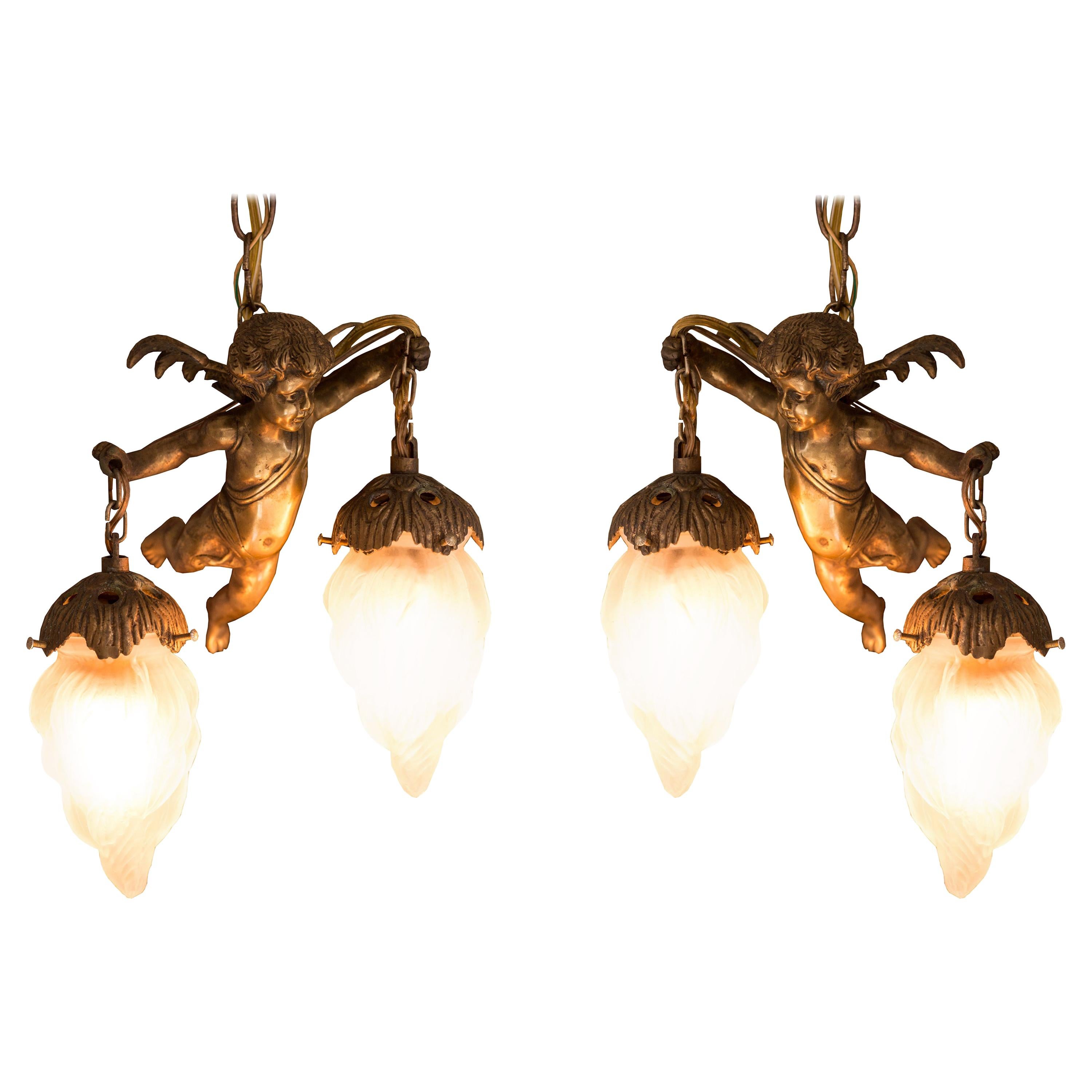 Antique Pair of French Gold Bronze and Glass Cherub Pendant Lights
