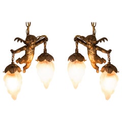 Antique Pair of French Gold Bronze and Glass Cherub Pendant Lights