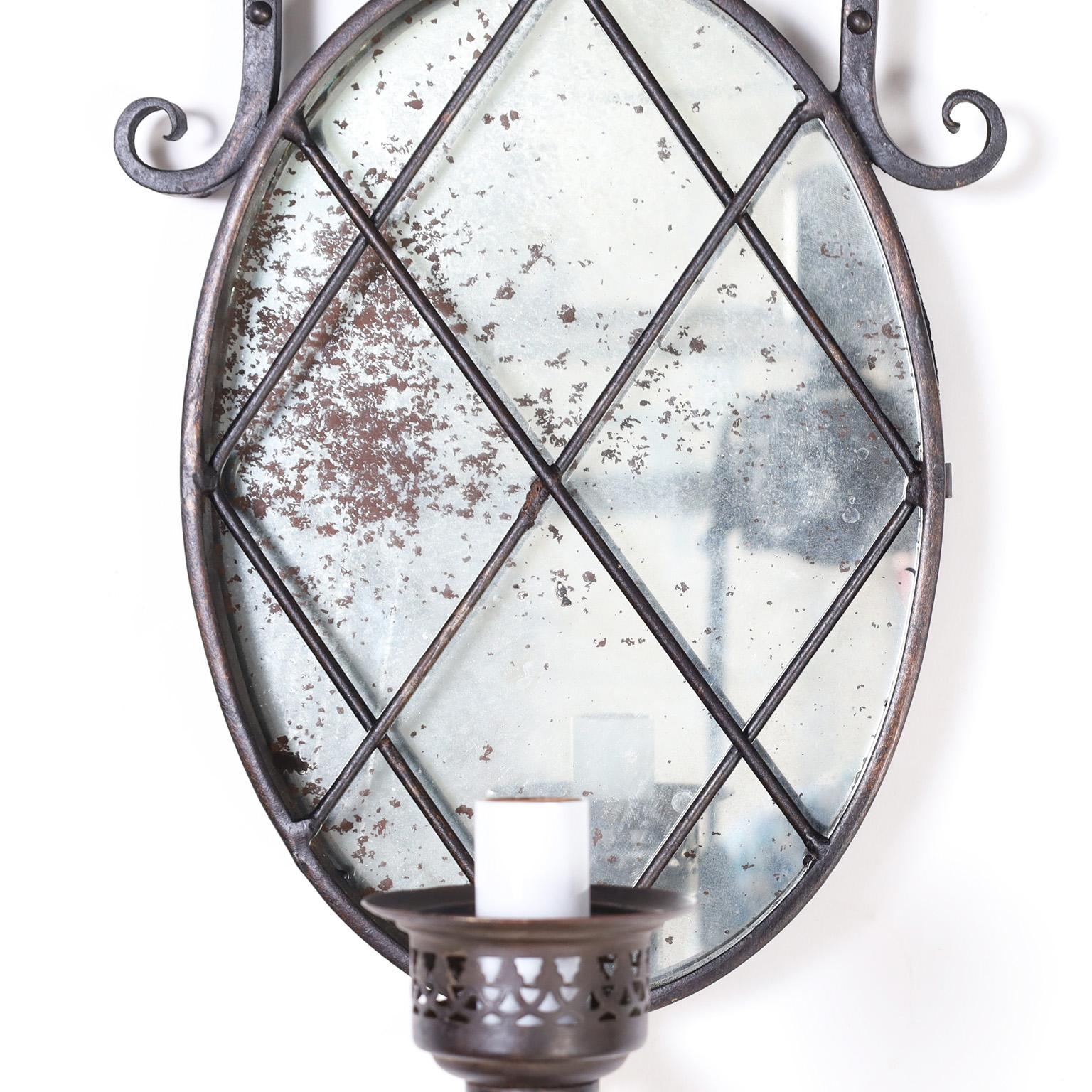 Wrought Iron Antique Pair of French Iron and Mirror Wall Sconces For Sale