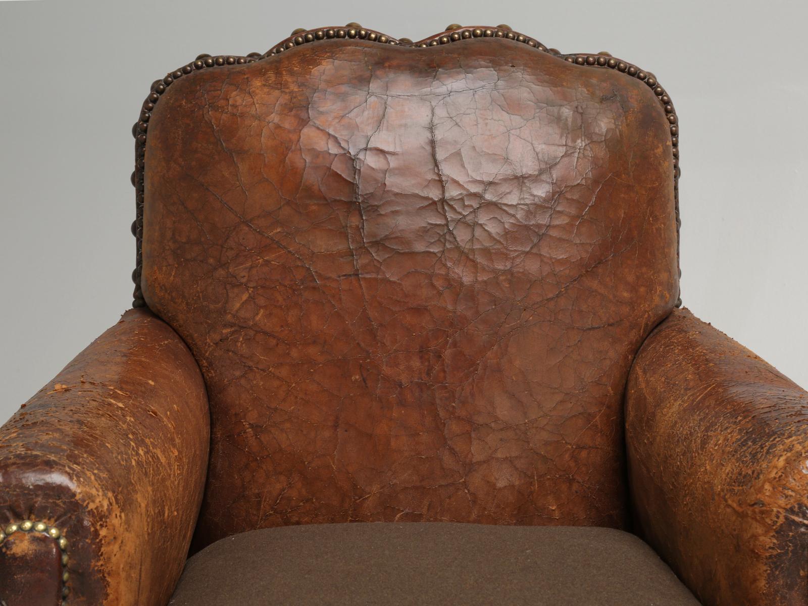 This particular pair of original French leather club chairs are the classic definition of; you can’t tell a book by its cover. By that I mean, everything under the skin of that scruffy 90-year old French leather, has been painstakingly restored in a