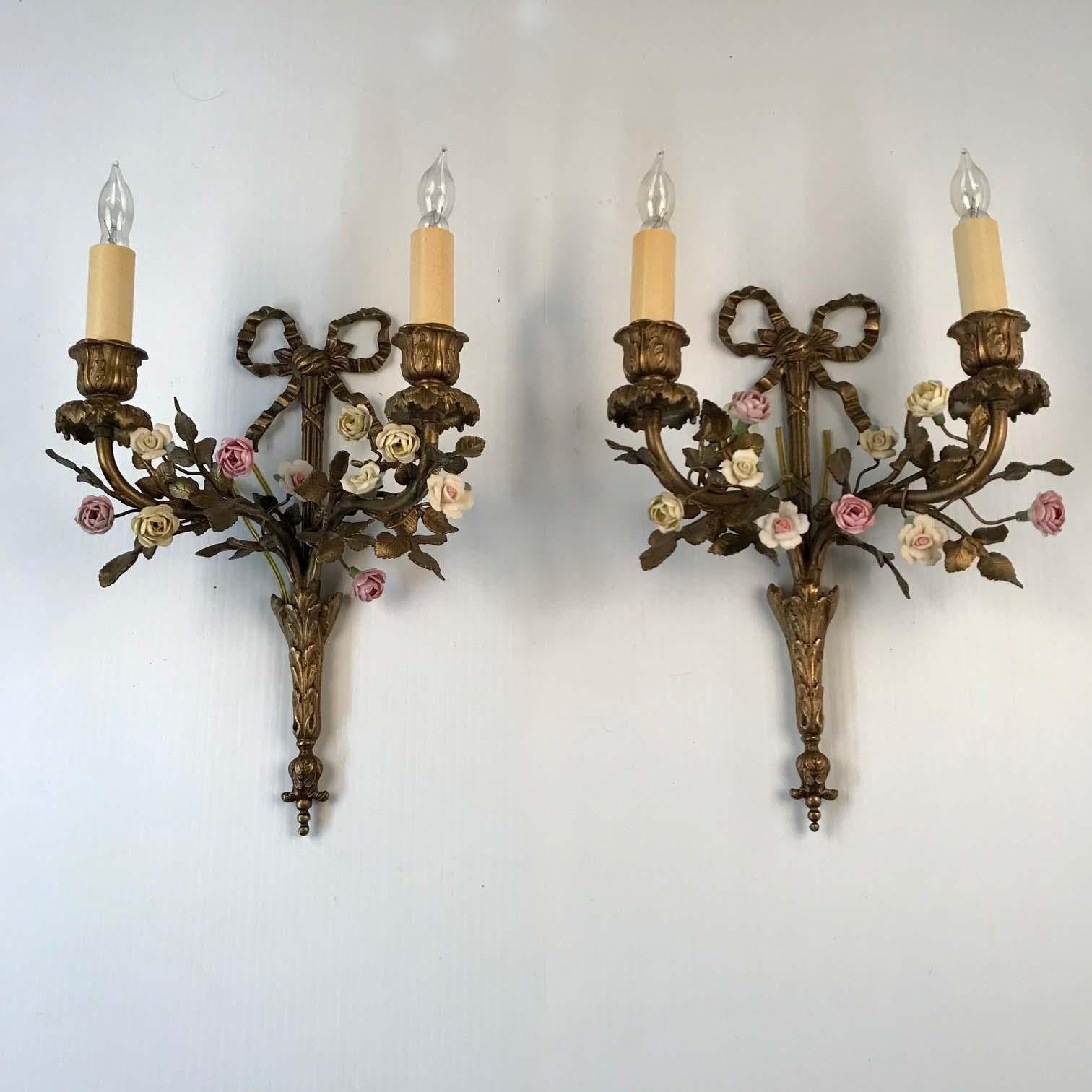 This charming and dainty pair combine the useful and the ornamental. Each with two lights, in stylised acanthus mounts provide the useful... but we also have leafy boughs and Vincennes style flower-heads, adding a 