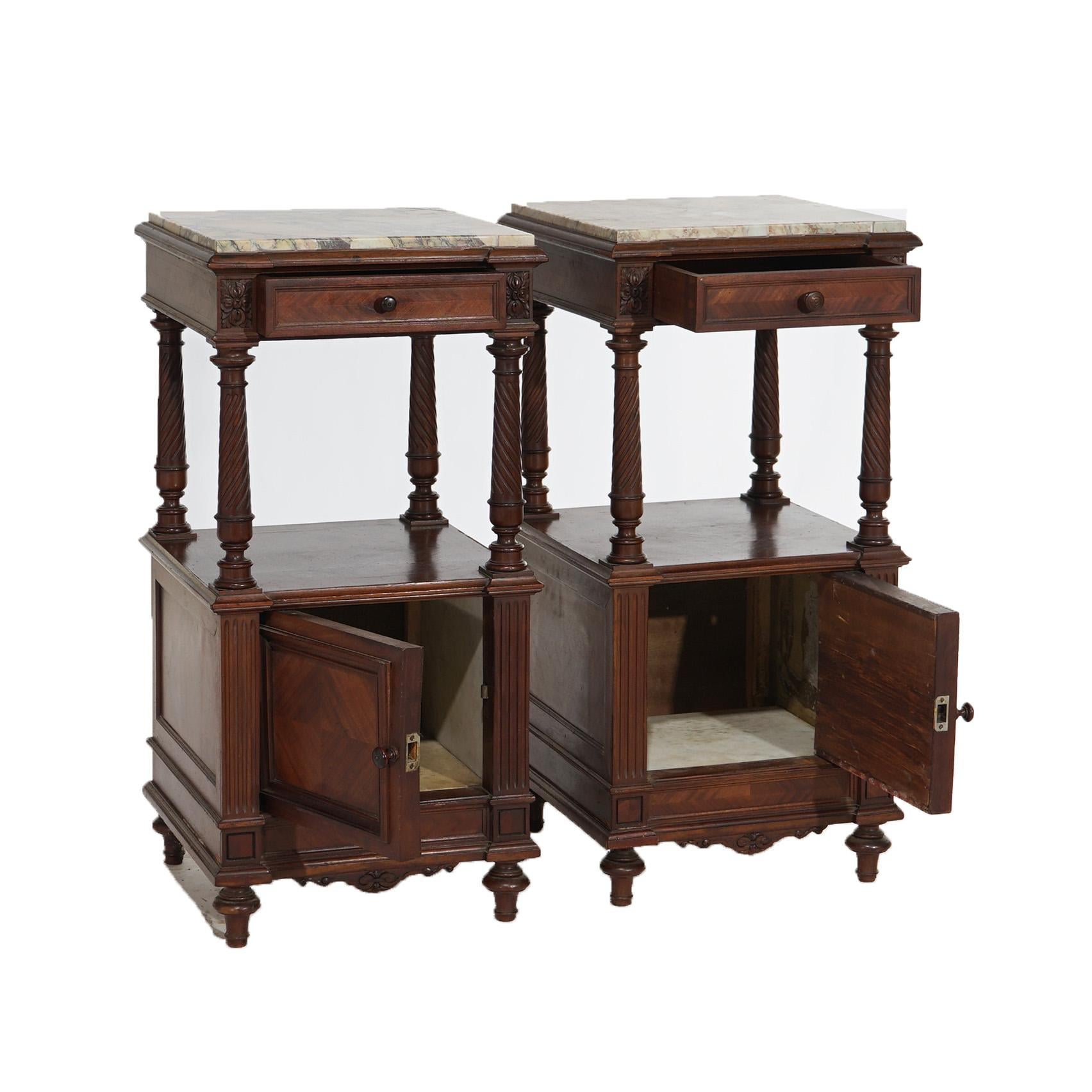 An antique pair of French Louis XVI style end stands offer kingwood and walnut construction with specimen marble tops over caser with single drawer, rope twist columns and lower blind cabinet, c1910

Measures- 32.75''H x 15.5''W x 16''D