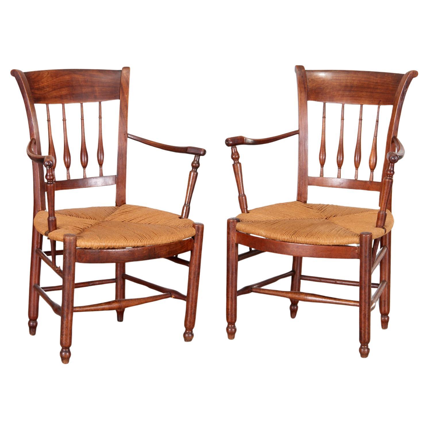 Antique Pair of French Provincial Turned Wood Arm Chairs with Rush Seats For Sale