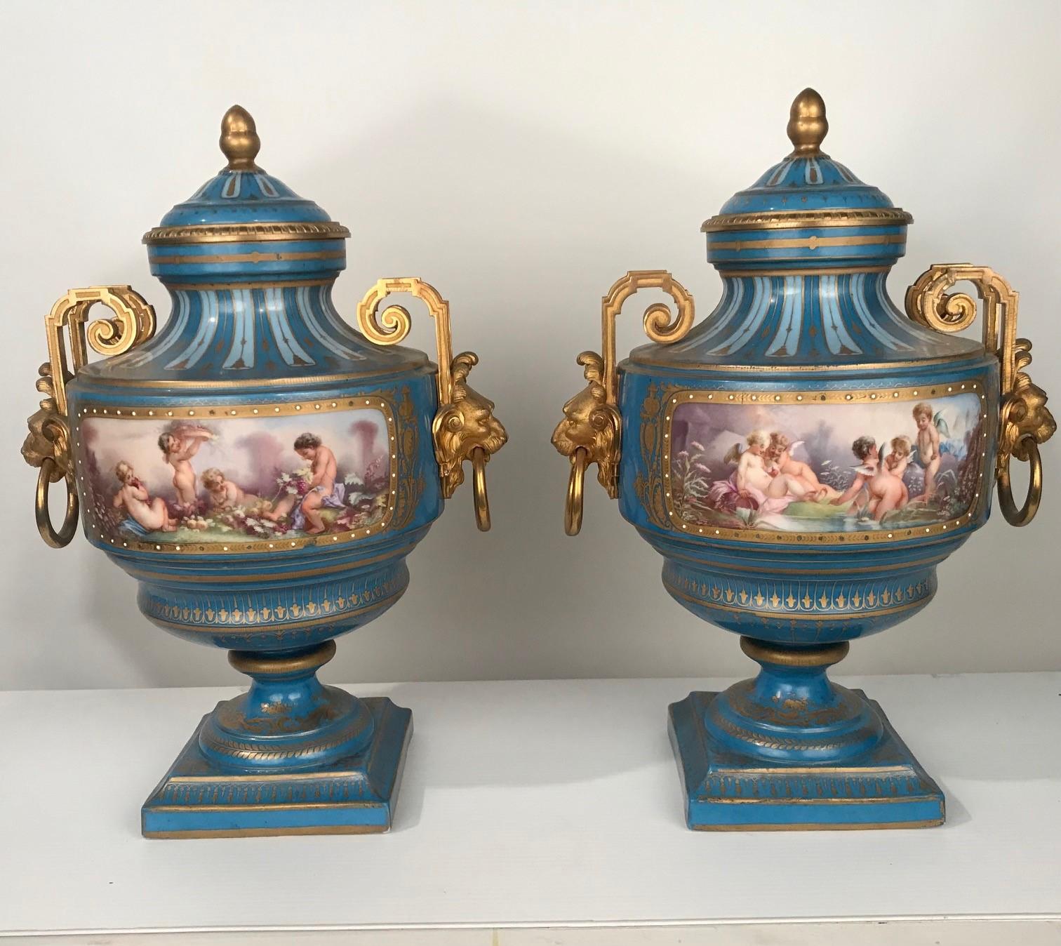 These are large, French and of excellent quality. From acorn finials to square stepped bases, this pair exude quality unmistakably. They have the de luxe look of items from the Belle Epoque. The vignettes show on one side putti bringing in the grape