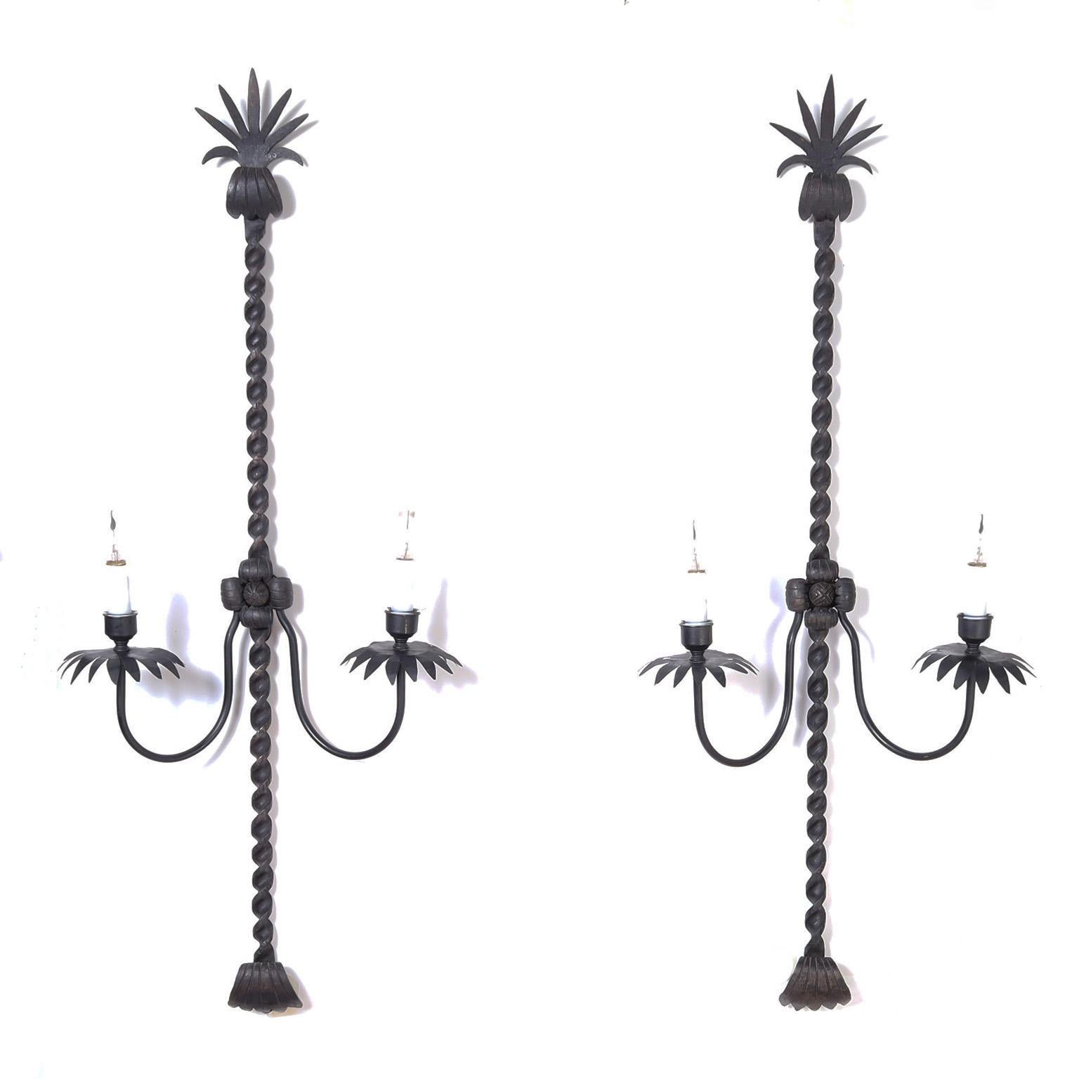 Tall and handsome two light French iron wall sconces, hand wrought, twisted, hammered and ready for the chateau.