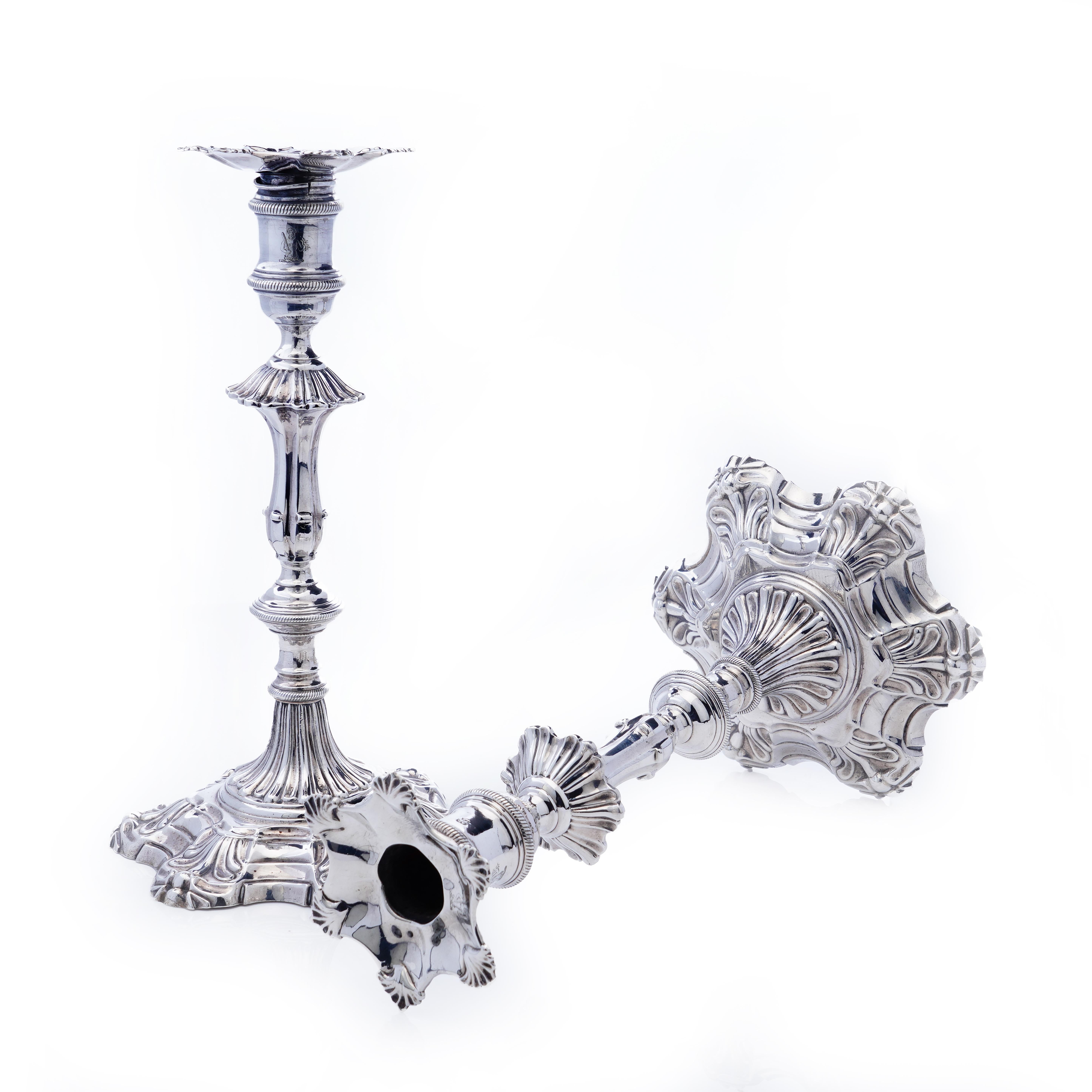 Antique pair of George II silver candlesticks
 Maker: James Morison
 Made in England, London, 1758
 Fully hallmarked.


Whether it's for dinner with friends or entertaining spirits in the attic, these candlesticks light your way. 
These rare
