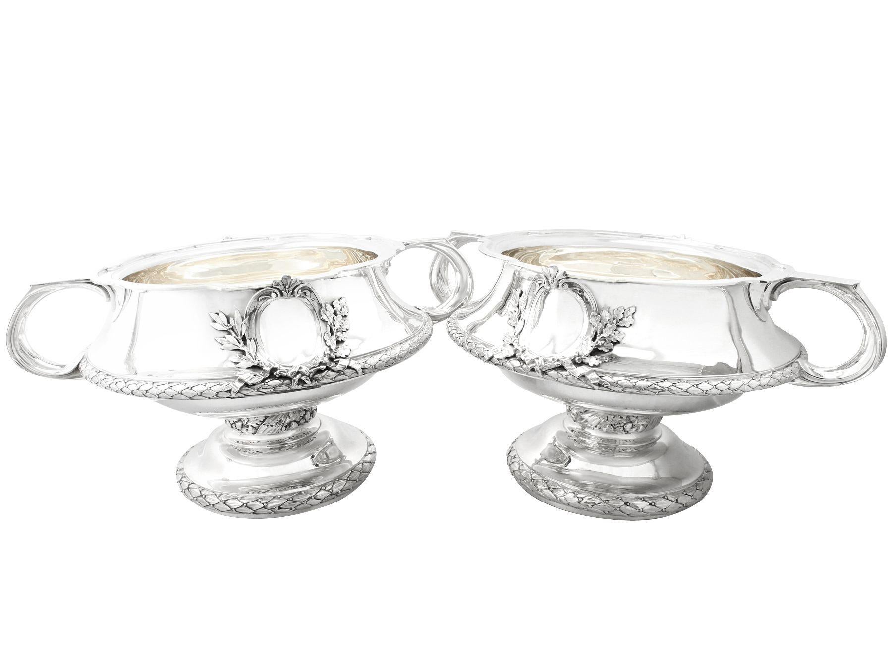 A magnificent, fine and impressive, large pair of antique George V English sterling silver bowls / centrepieces in the Art Nouveau style, an addition to our presentation silverware collection.

These magnificent and large antique George V English