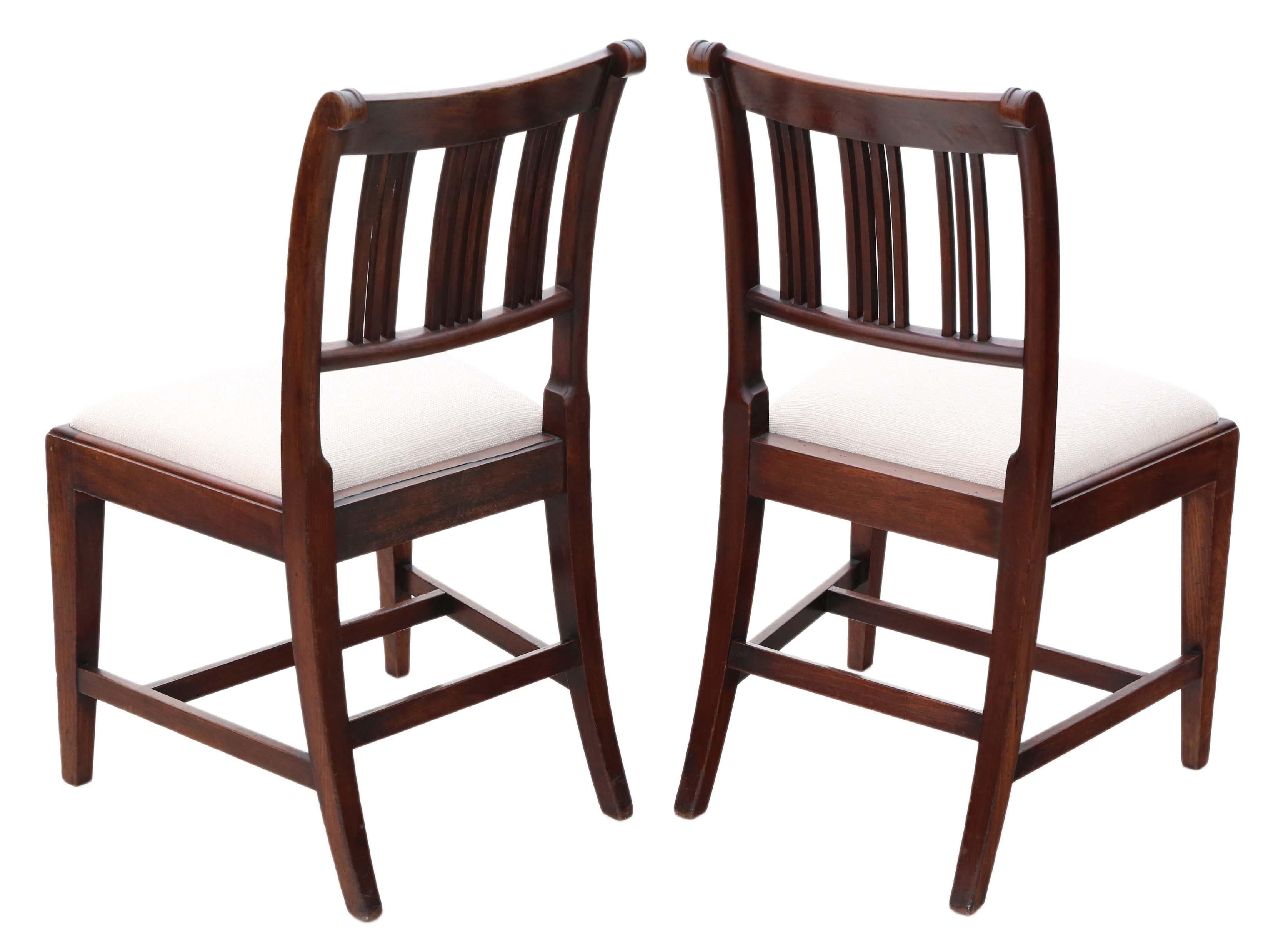 Antique quality pair of Georgian 19th century mahogany dining side hall or bedroom chairs.

Date from circa 1810.

Solid, with no loose joints.

New upholstery in a heavy weight upholstery fabric, with an off-white color.

Overall maximum