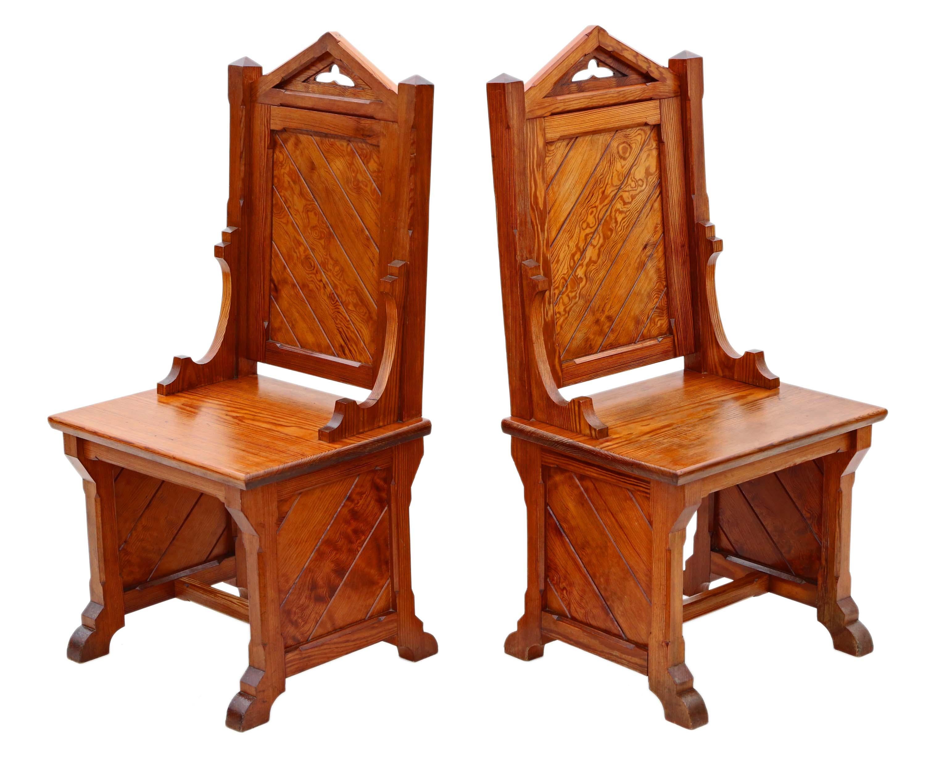 Antique quality pair of Gothic pitch pine throne, side, hall, or bedroom chairs C1900.

Solid and heavy, with no loose joints and no woodworm.

Overall maximum dimensions:

59cm W x 50cm D x 119cm H.

In very good antique condition with
