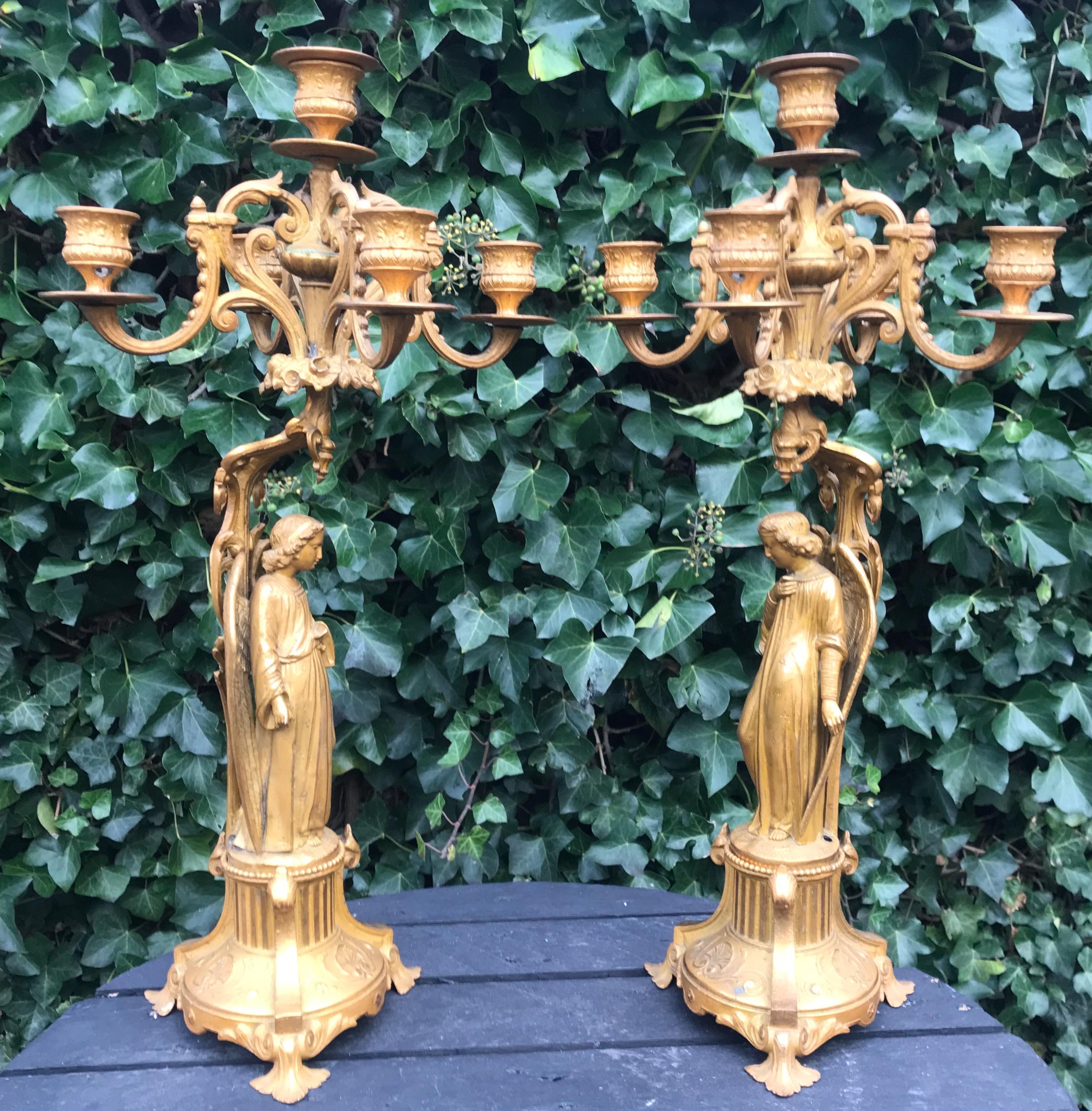 Large and very decorative pair of sculptural candleholders.

If you are looking for a beautiful and meaningful pair of antique candelabras to grace your living space then this original pair from the French Gothic Revival era could be the one for