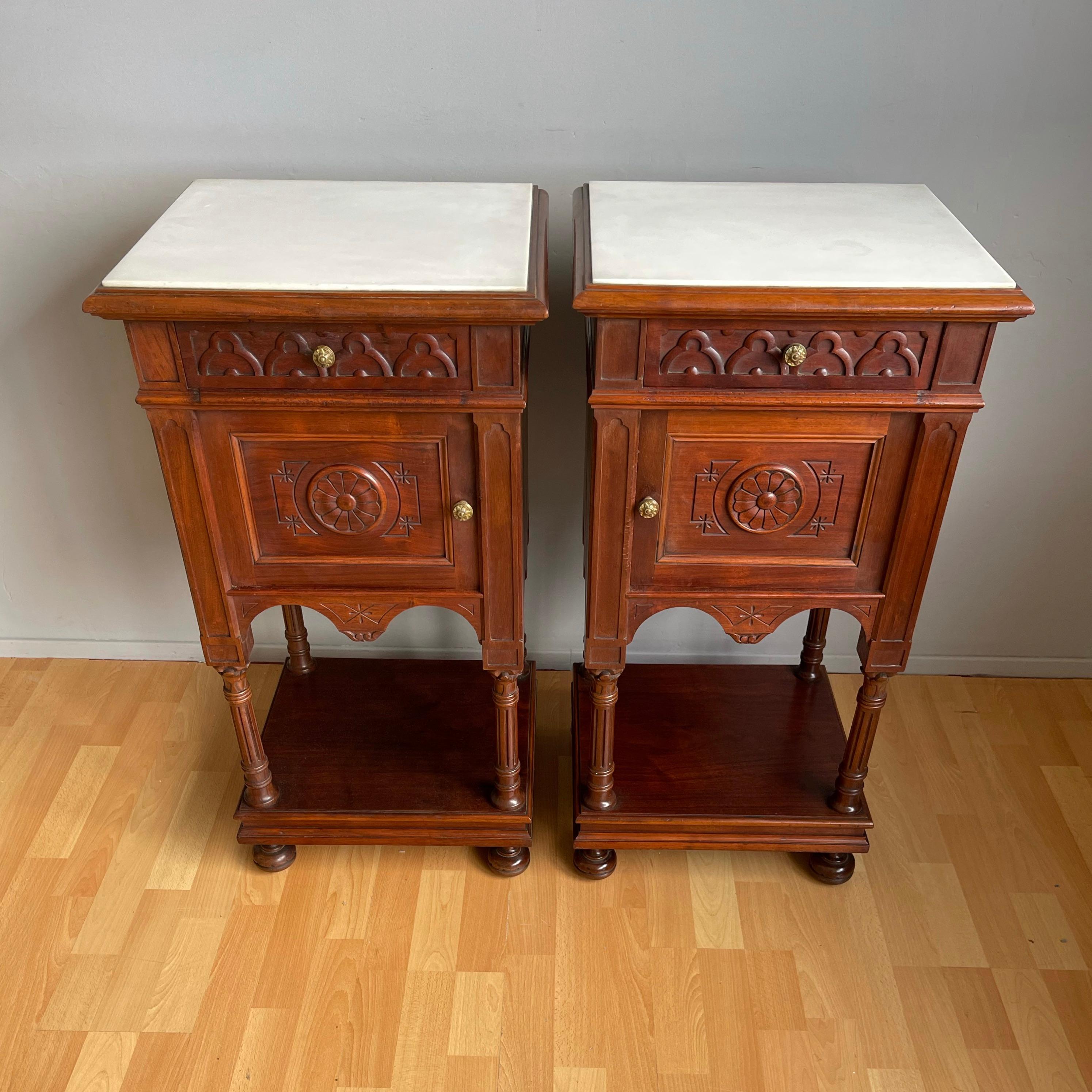 Handcrafted and perfectly hand carved nightstands with white marble tops, circa 1870.

If you are looking for a beautiful pair of practical night stands then this rare Gothic duo from the Victorian era could be gracing your bedroom soon. Mind you,