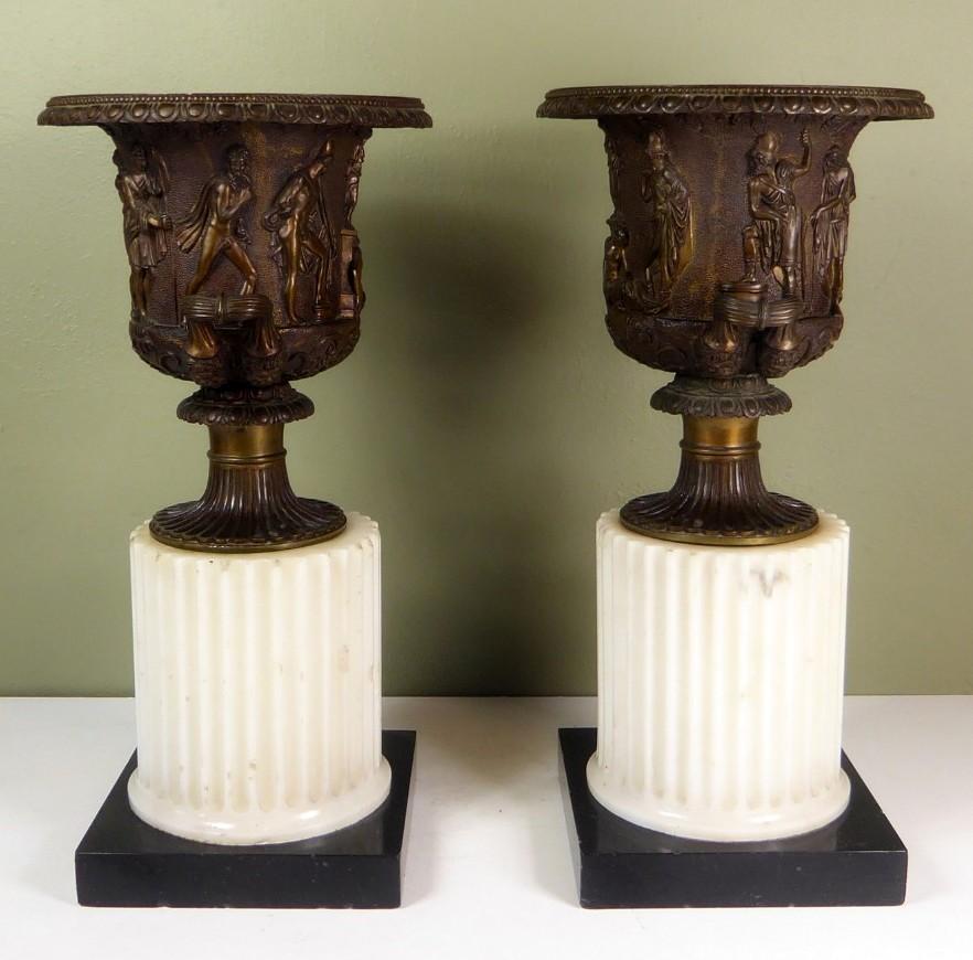 Impressive Pair of Grand Tour Twin Handle Patinated Bronze Medici Urns of Campagne outline, of compact and heavy proportions. Second quarter of the Nineteenth Century. Firmly attributed to Giacomo Zoffoli. 

These Urns are in the Borghese or