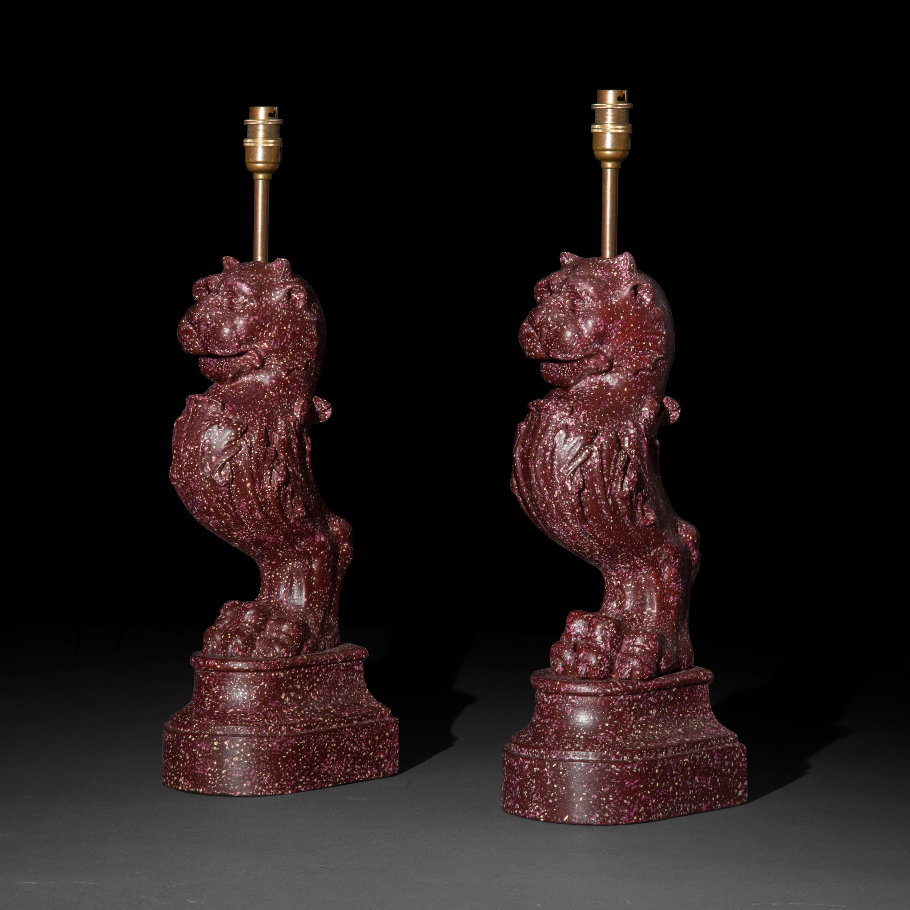 An interesting pair of Regency style cast metal table lamps, modelled as Roman lion-headed trapezophoros, decorated to simulate Egyptian imperial porphyry.

Why we like them
A rather unusual object; well-cast and of great heavy quality. We love
