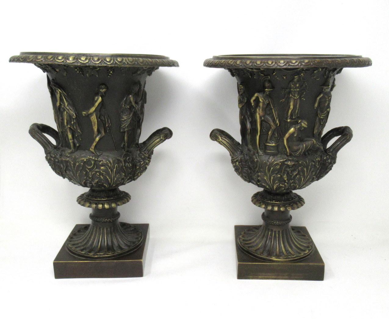 Impressive pair of Grand Tour style twin handle patinated bronze Campagne urns, of generous and heavy proportions. 19th century style made circa 1950s. 

These Urns are in the Borghese or Medici style model with classical relief decoration, egg