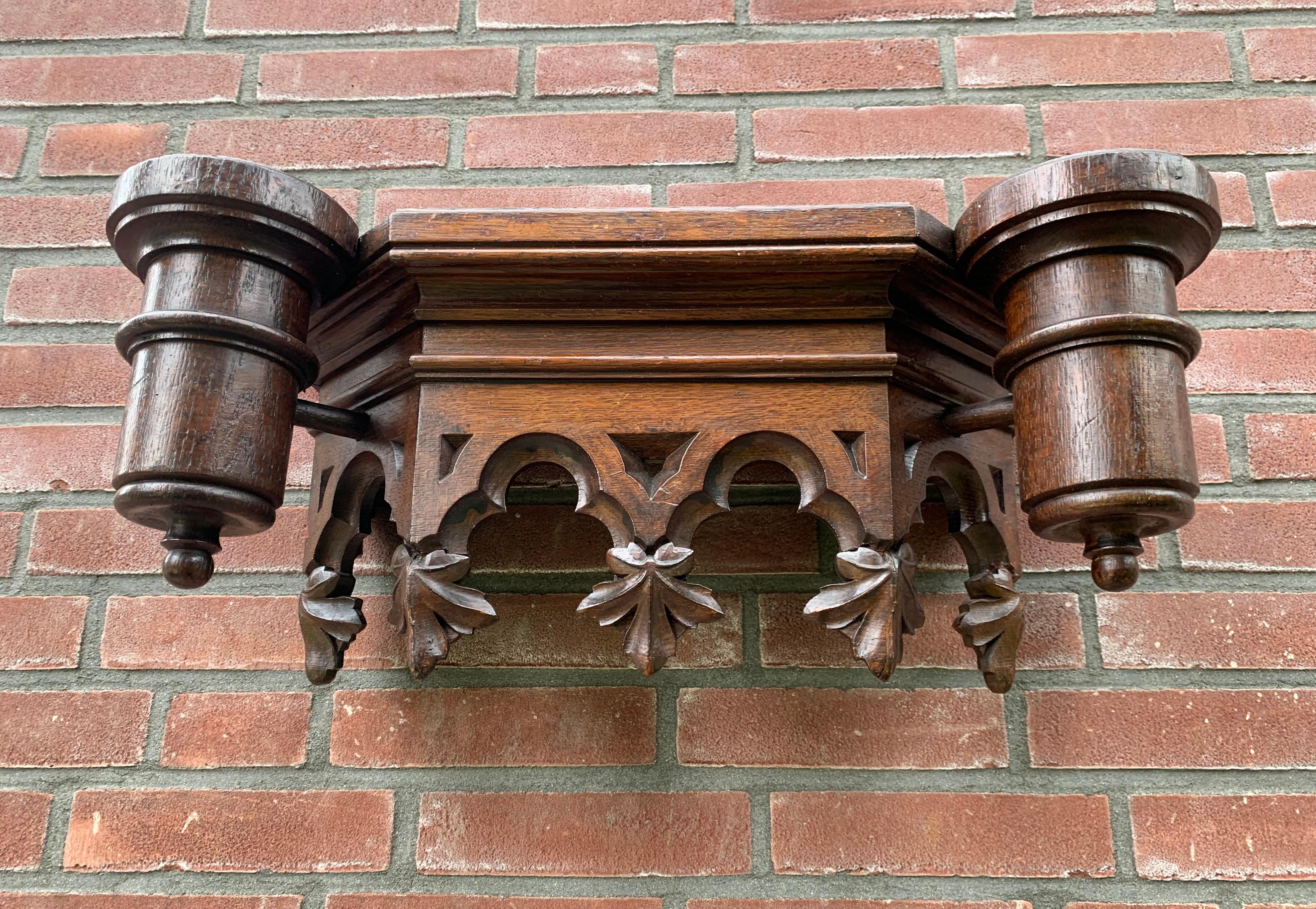 Matching pair of hand carved Gothic Revival church wall brackets / display shelfs.

If you are a private collector of Gothic antiques or if you are looking for the perfect pair of Gothic wall brackets for your church or monastery then this stunning