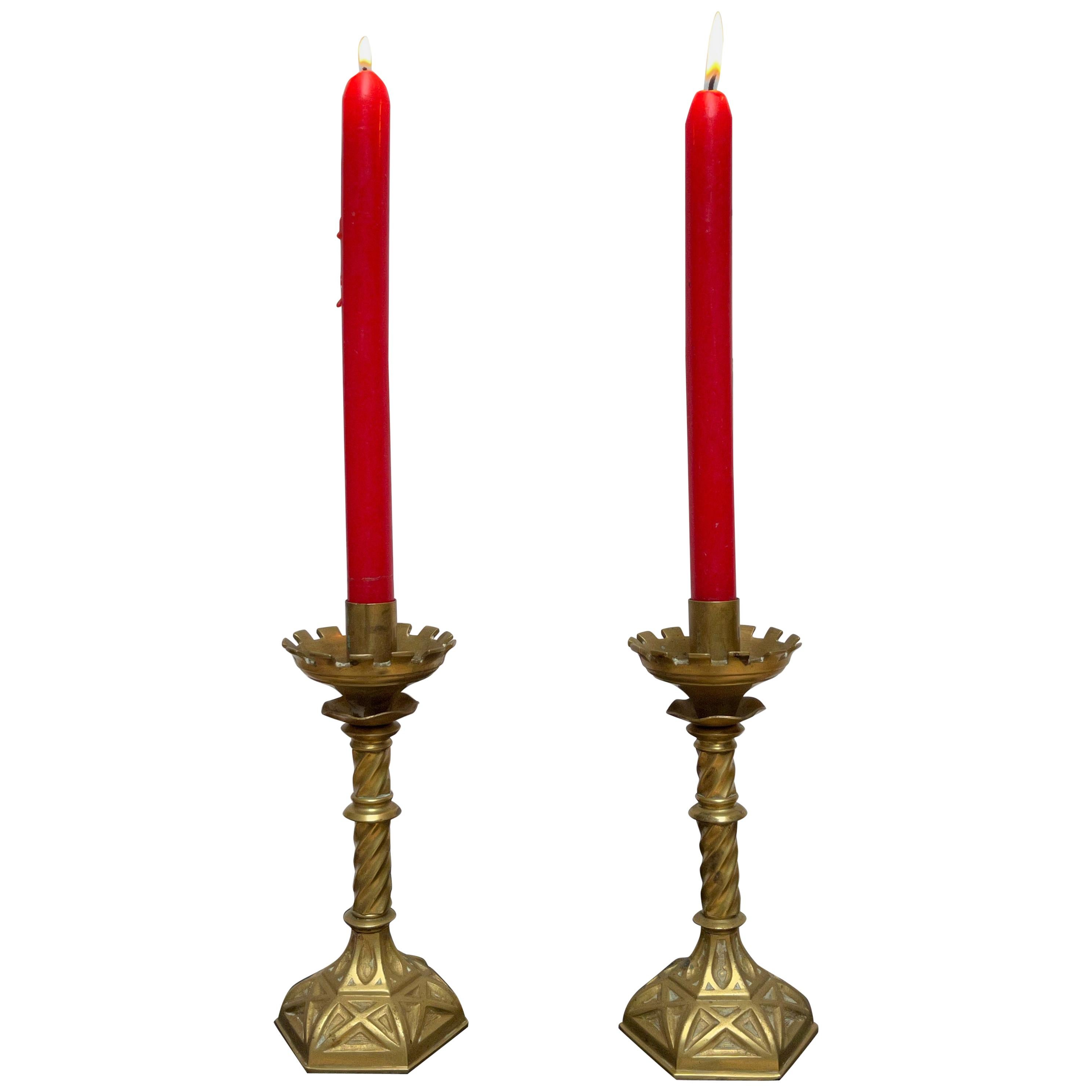 Great pair of 19th century candleholders.

If you are looking for a stylish and small pair of church candle holders to create a special atmosphere then this handcrafted pair could be perfect for you. The 'teeth' on top of this rare pair are like the