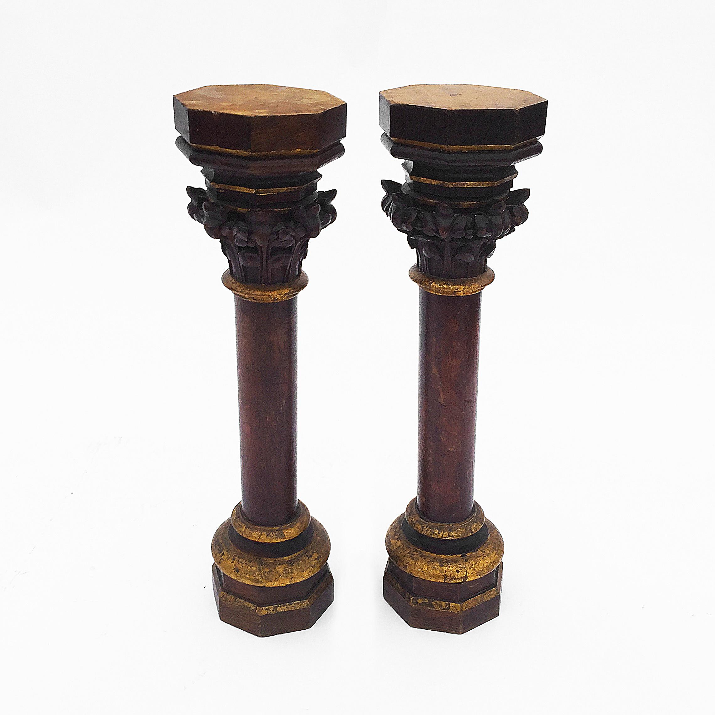 A handcrafted pair of small oak Gothic church columns from the late 1800s. Vanished with gilded details and beautiful 100 year patina all-over. Imported from Belgium and specifically from the Flemish region. The can be used as architectural feature