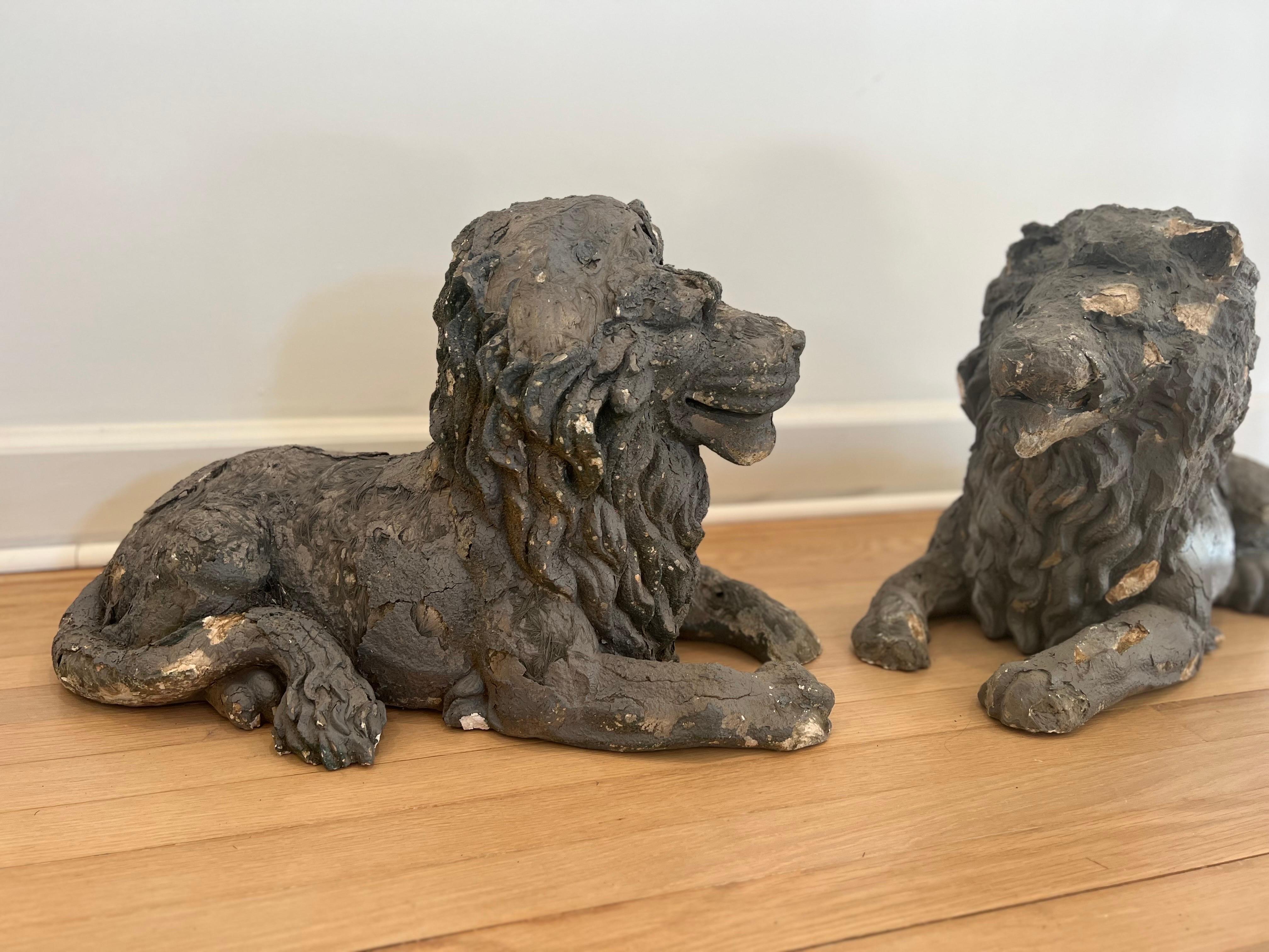 Truly one of a kind pair of old handmade reclining lions. These are unsigned and used a mixture of clay and fiberglass fibers. 

They show very heavy signs of loss over the years but adds to the character and significance. 

Make a true
