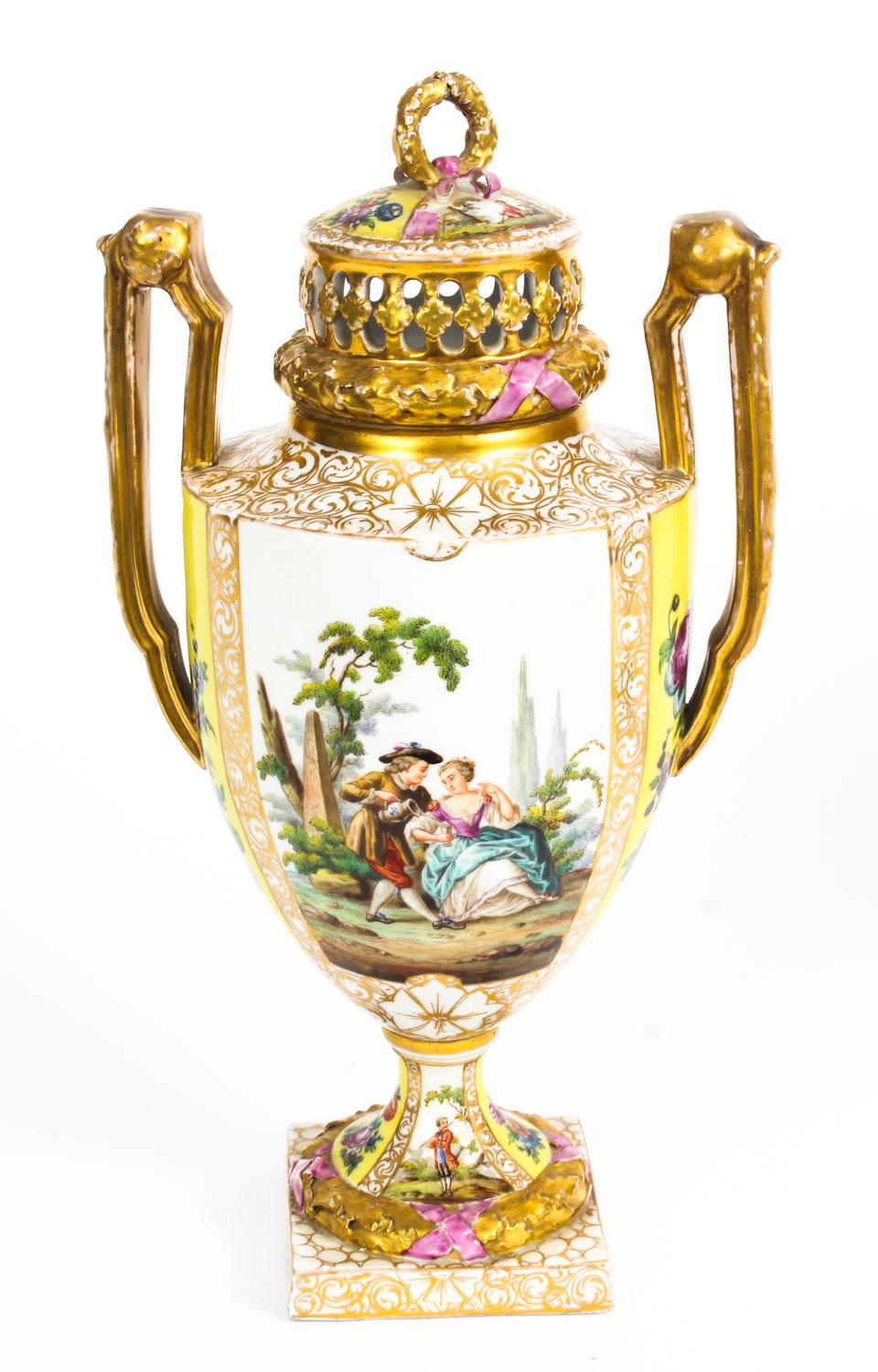 This is a beautiful antique pair of Helena Wolfsohn two handled pot pourri Dresden porcelain vases and covers, circa 1880 in date.

Each painted with alternating gilt edged panels of figures in romantic landscapes and floral bouquets on a yellow